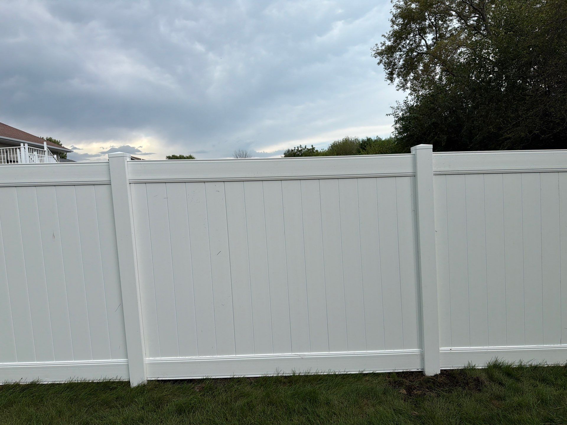 White Vinyl Privacy Fence Installation in Raymond, IA by Perfect Picket Fence and Stain