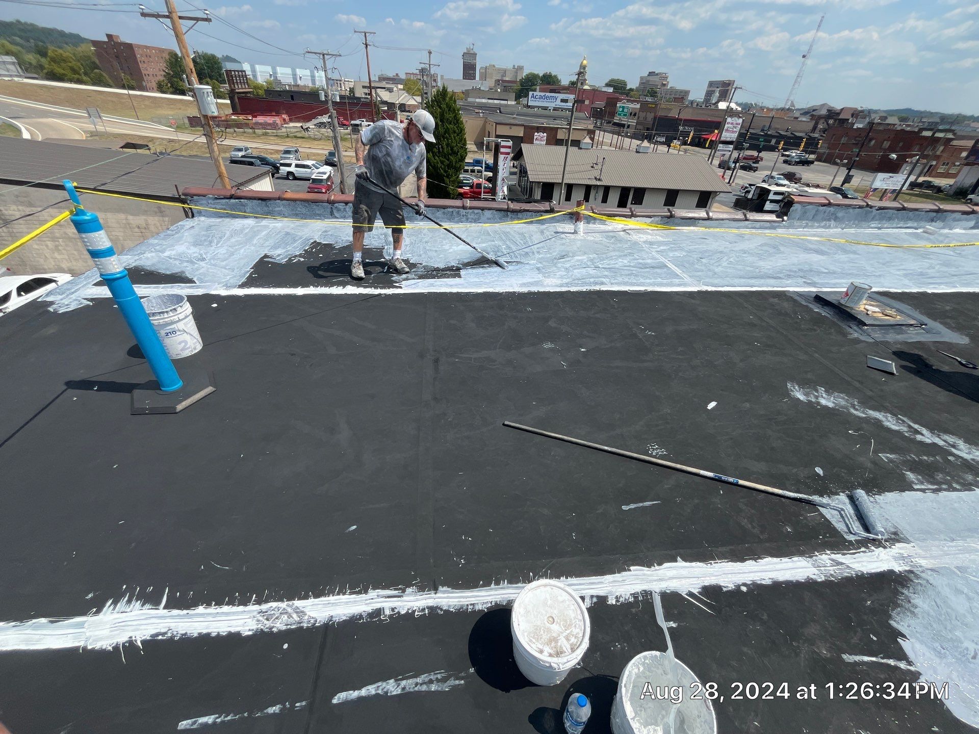 Commercial Roofing Installation using smartcoat Roof coating by Fahey Roofing + Contracting