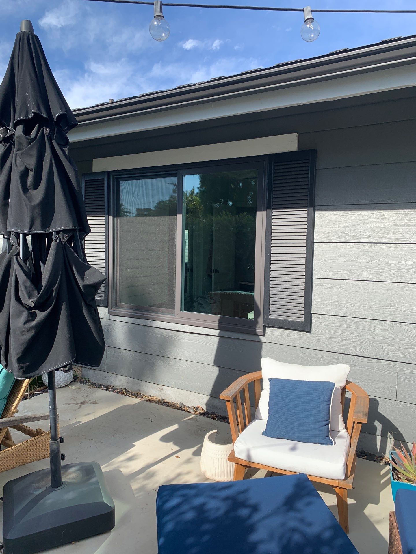 Window Installation using Milgard black vinyl windows by American Window Company