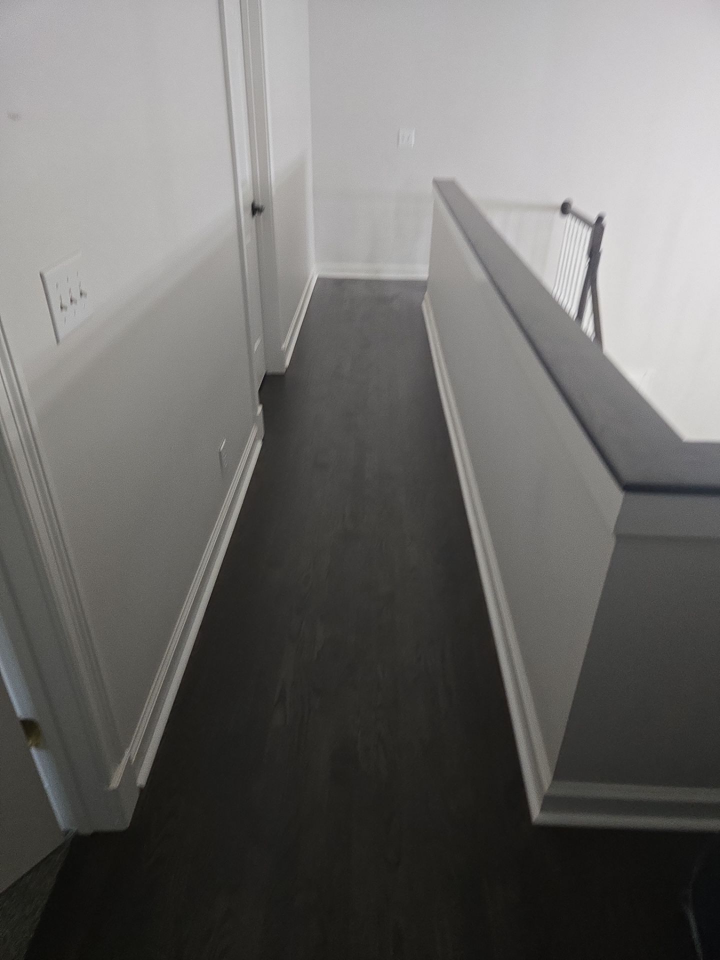 Updated staircase and hallway by Footprints Floors of Nashville