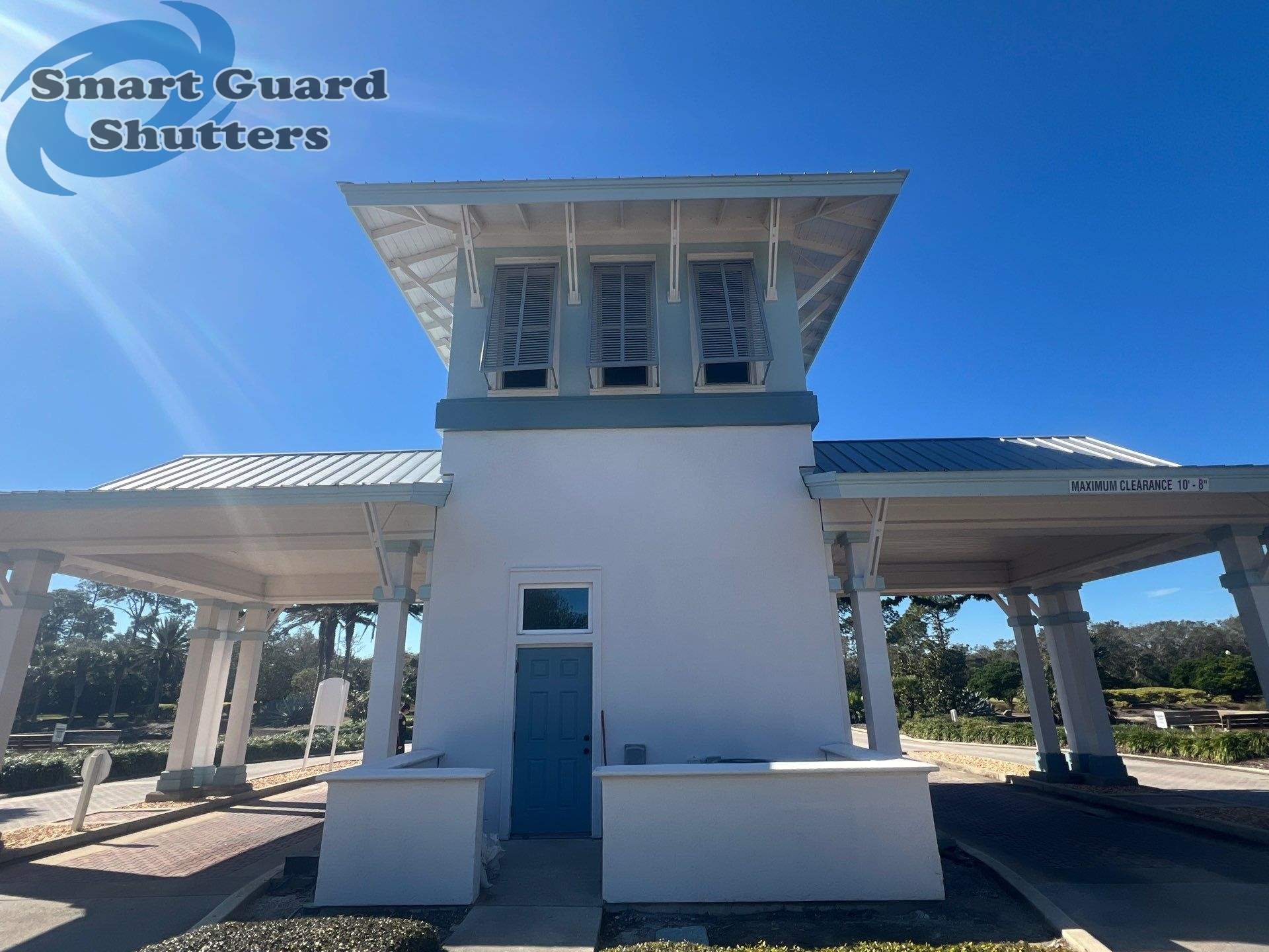 Decorative Bahama Shutters in Window Grey by Smart Guard Shutters