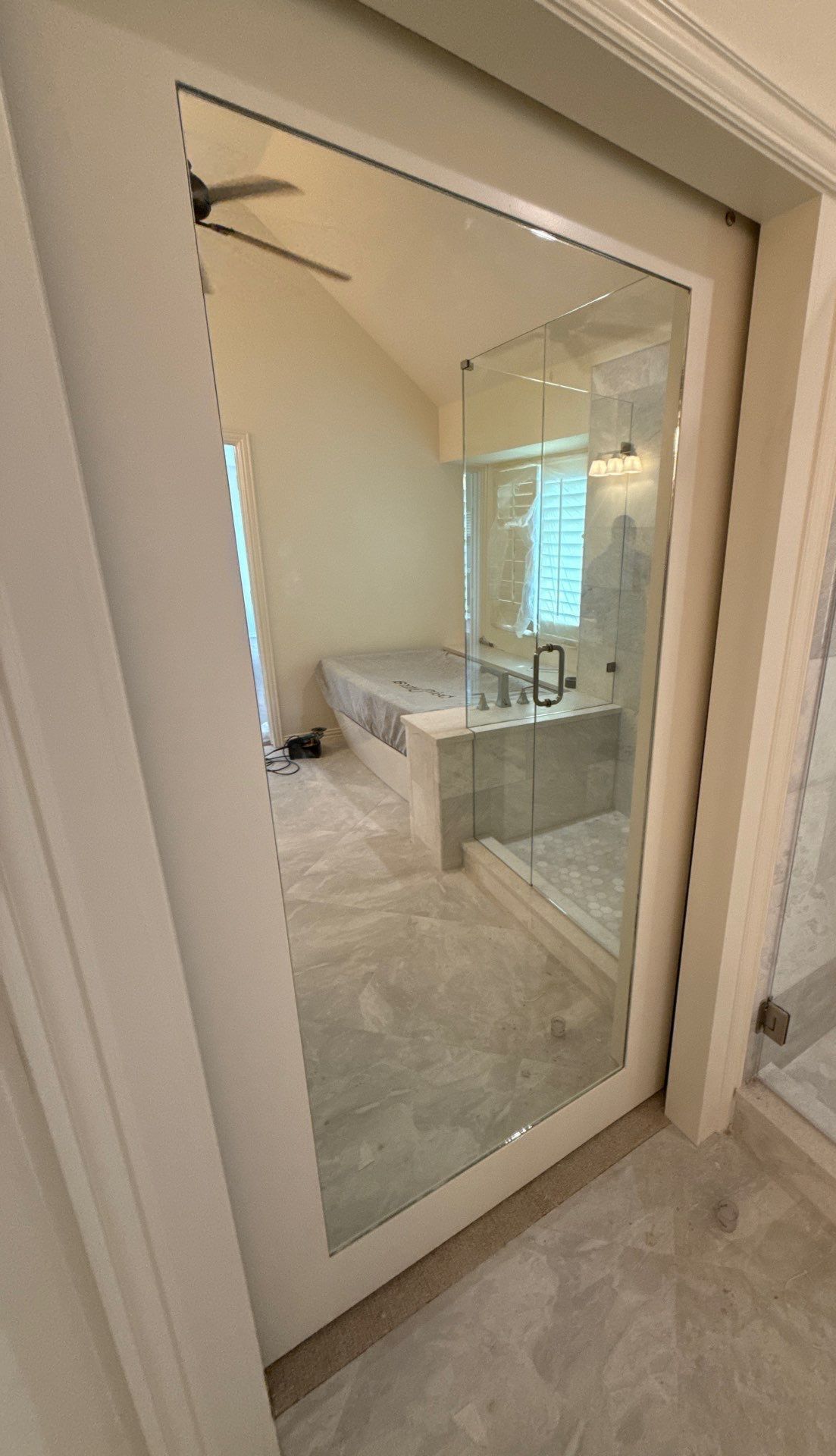 Frameless Shower and Mirror for Closet Applied to Pocket Door by Richardson Glass & Mirror