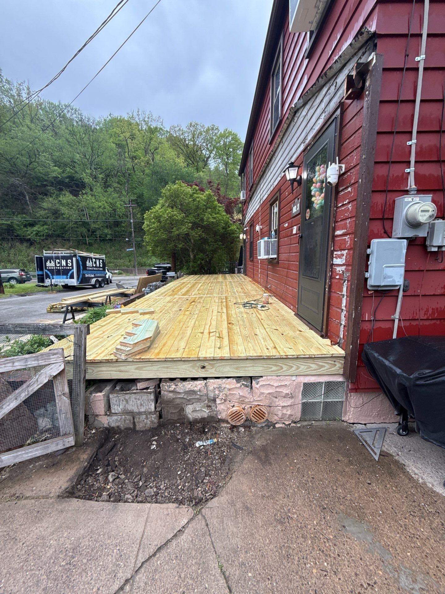 Roof sunspace deck  by Cousins Roofing Siding & Decks