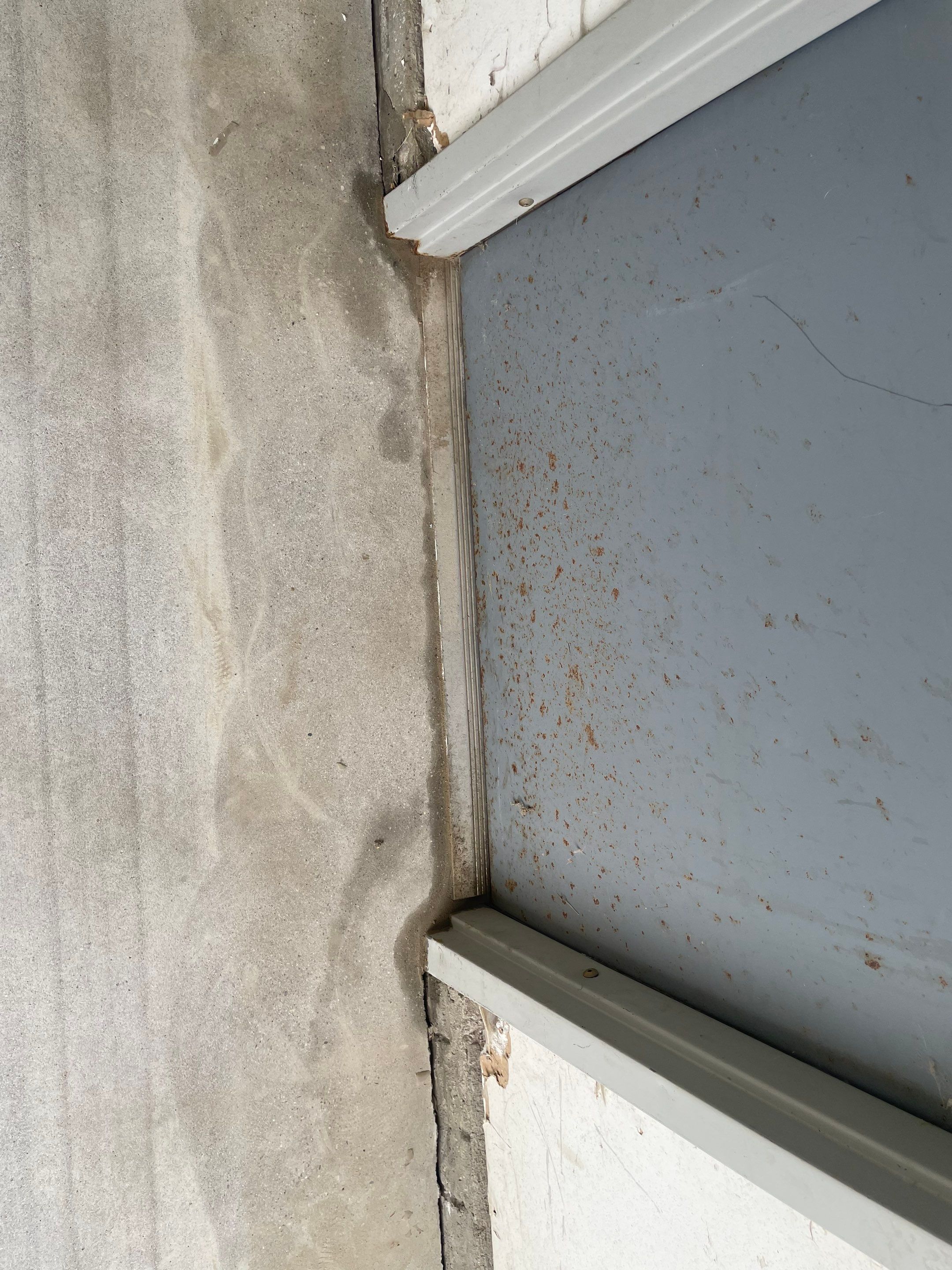 Coyote Flake Concrete Coating for Sioux Falls Garage by Select Painting, Coatings & Garage Cabinets