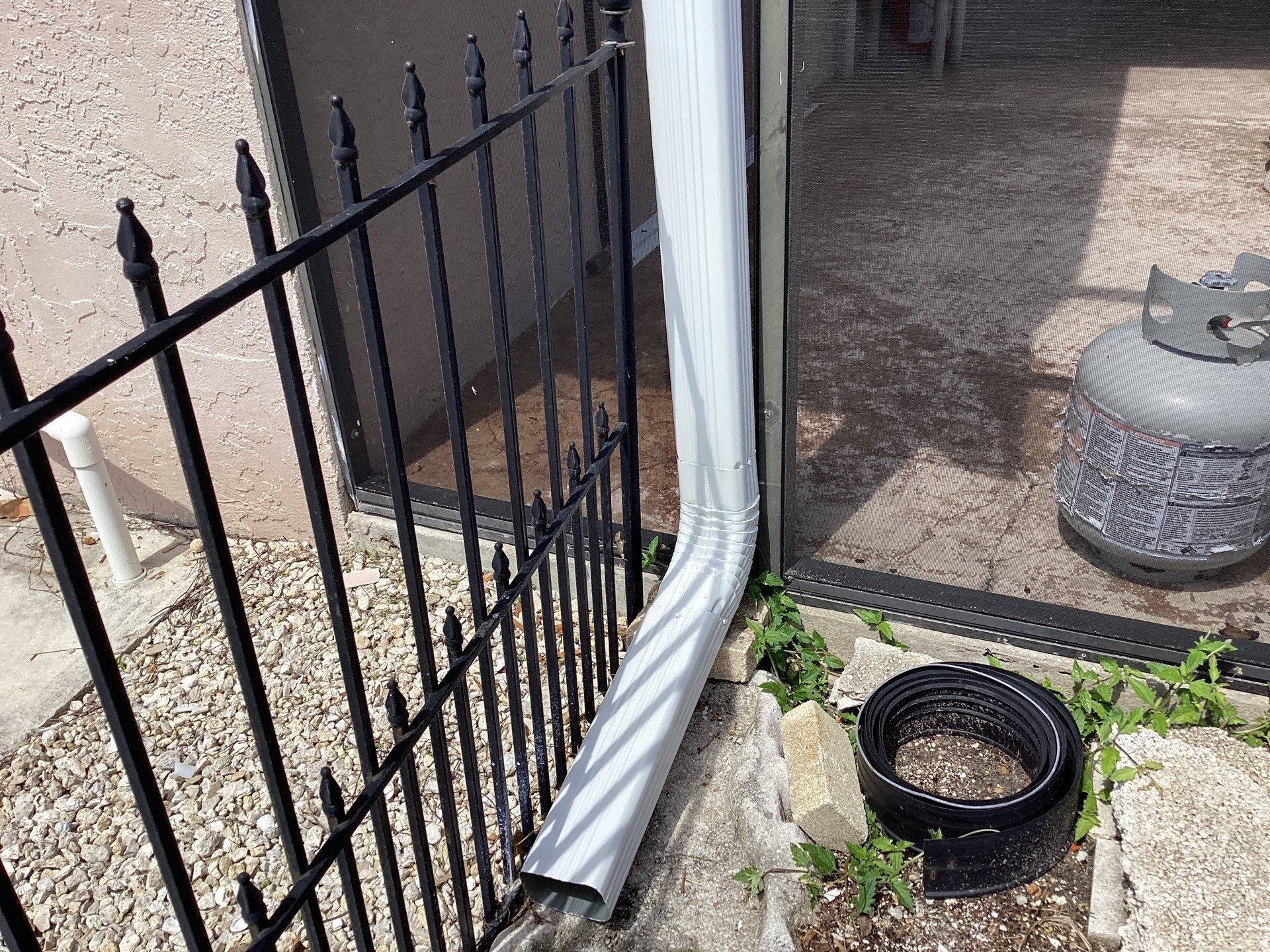 White Seamless Gutters and Splash Guards in Fort Myers FL by Gutter Professor by Gutter Professors