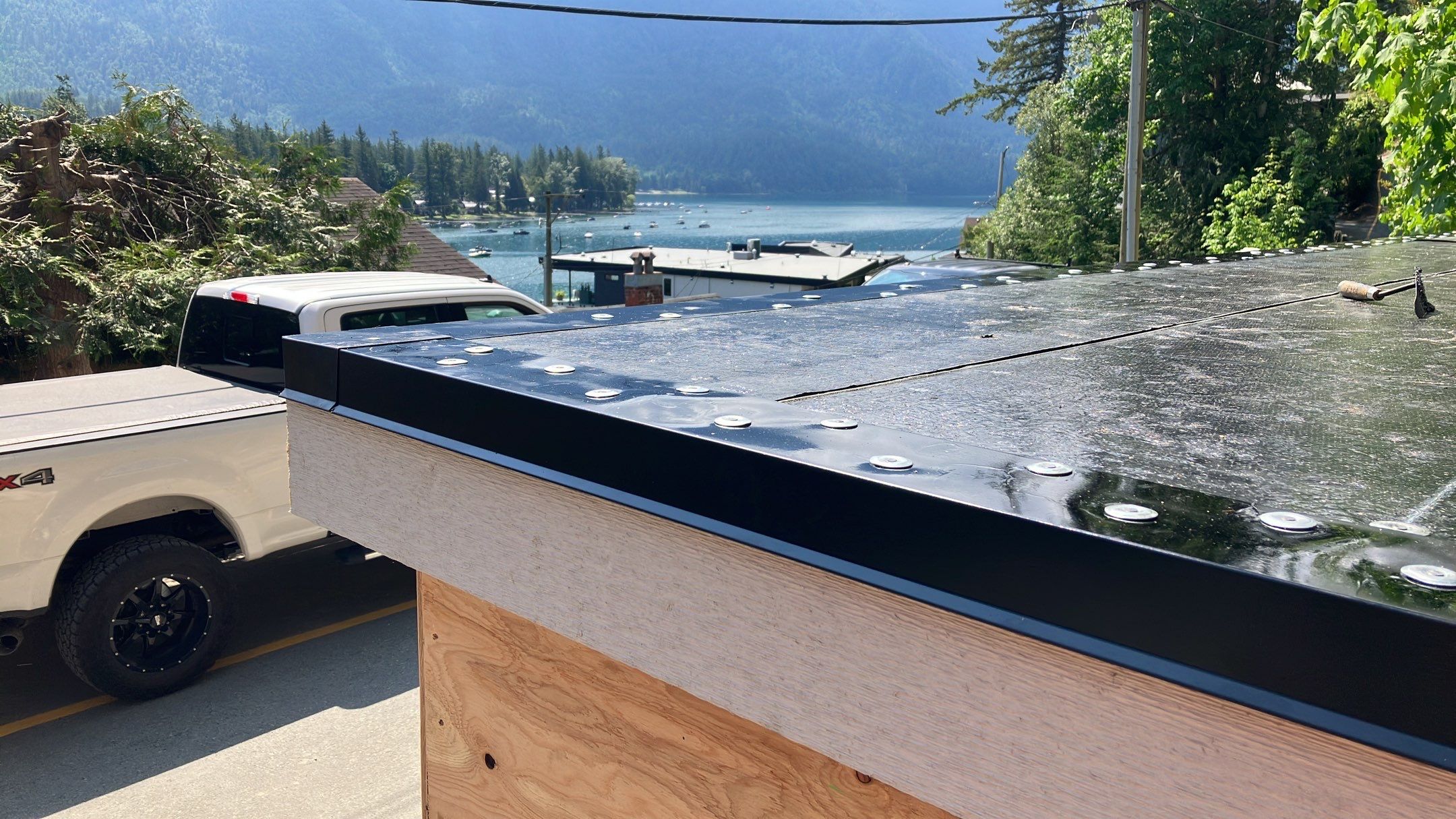 Small patio roof with 2ply sbs  by Top Notch Roofing Inc