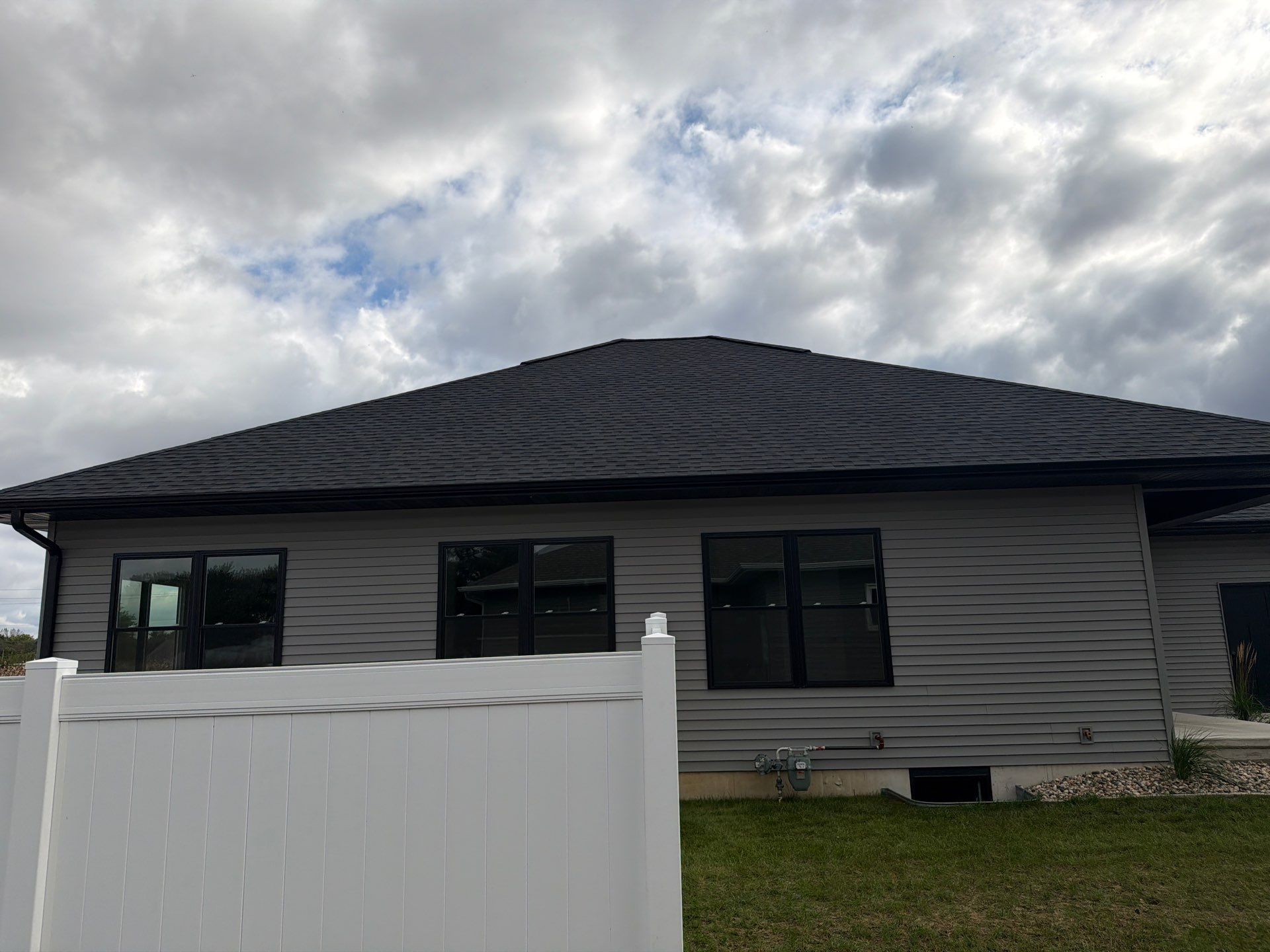 Residential White Vinyl Privacy Fence Installation in Janesville by Perfect Picket Fence and Stain