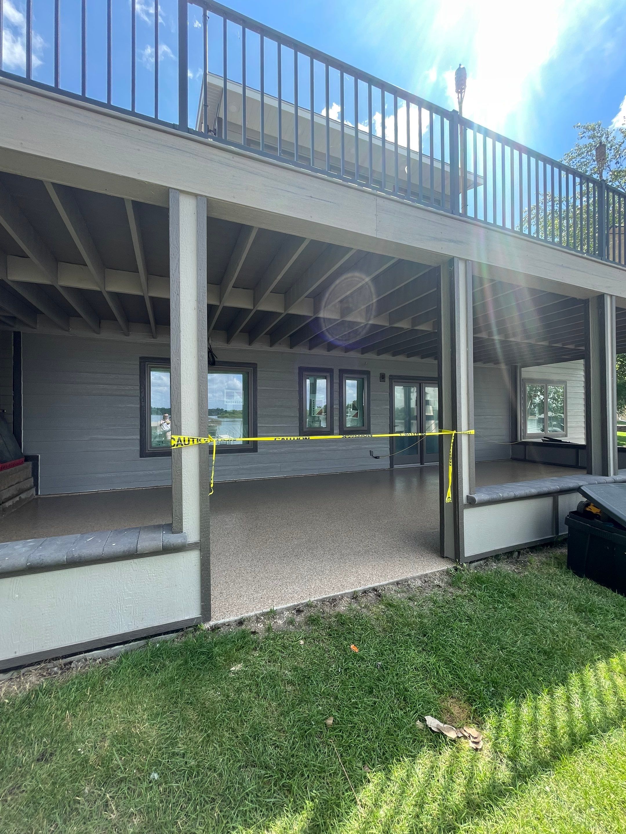 Lakefront Screened Patio Concrete Coating Installation in Wentworth by Select Painting, Coatings & Garage Cabinets