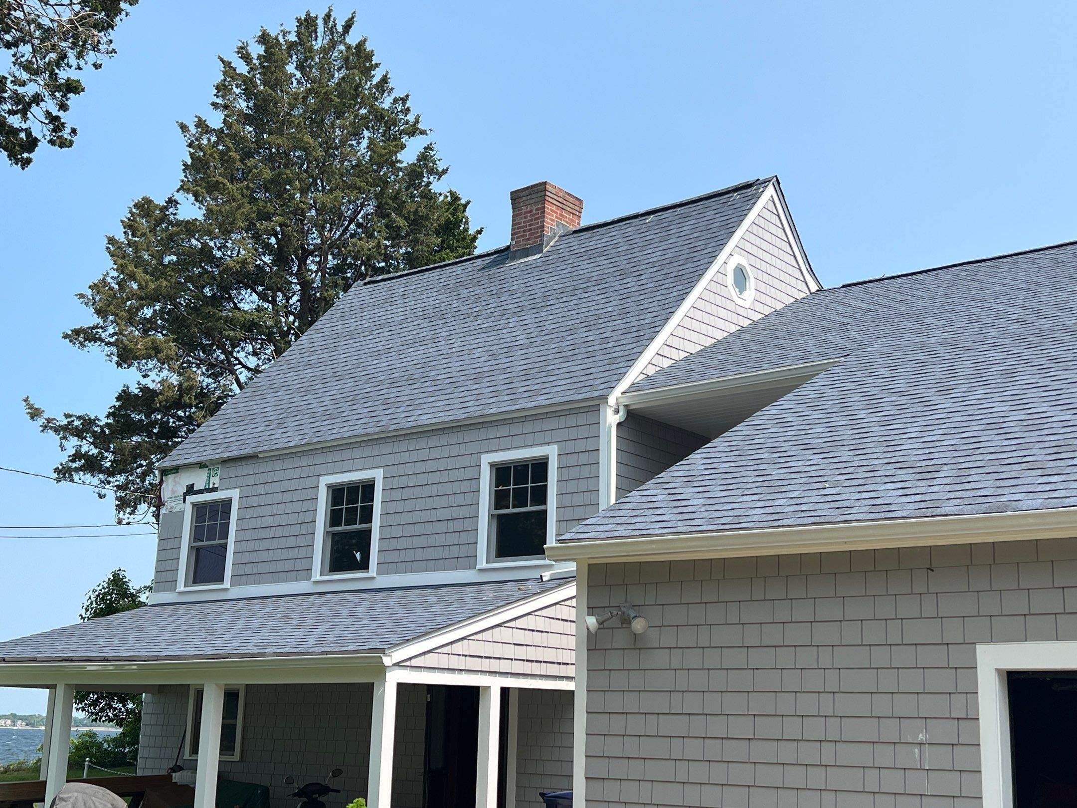 Coastal Blue Roofs by Pinnacle Roofing & Skylights