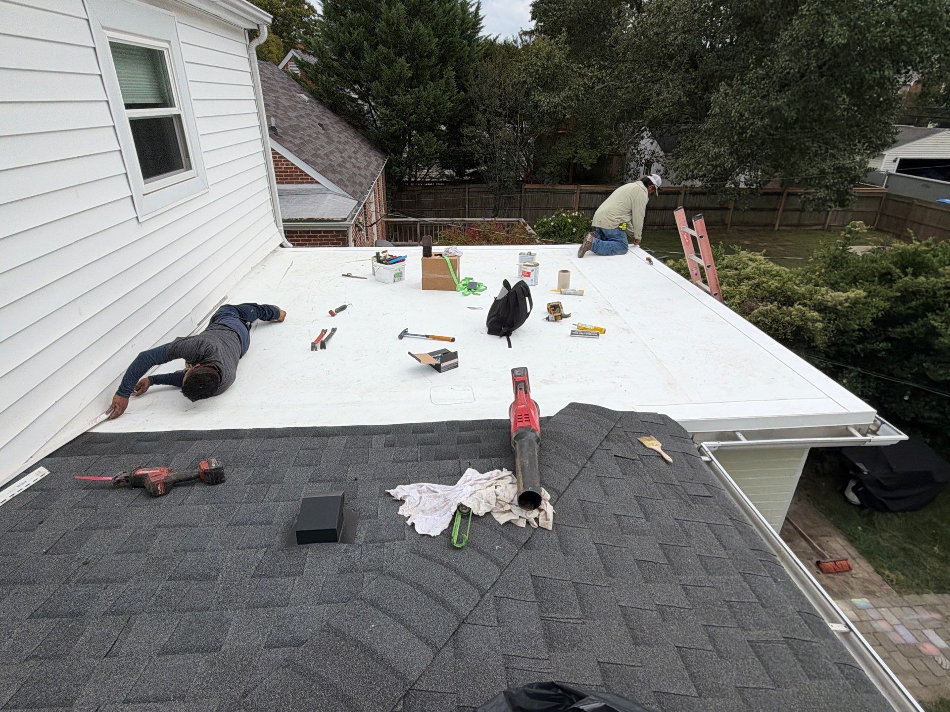 Richmond Roof Replacement Including Flat Membrane and Asphalt Shingles by Cade Construction