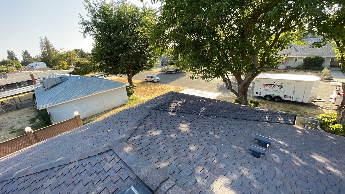 Installation of Certainteed Presidential shingles on residential house by Straight Edge Roofing Inc