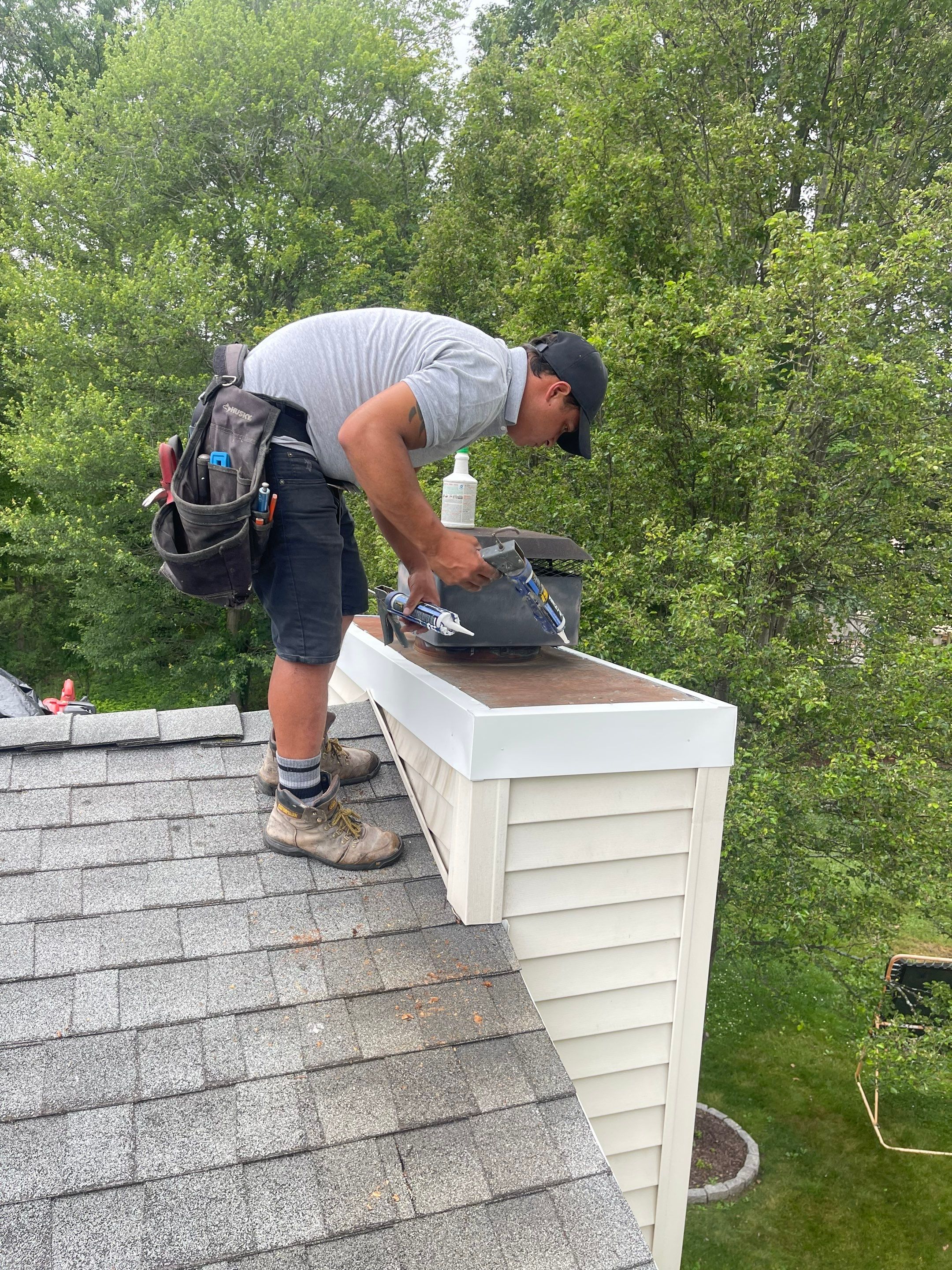 Gutter Cleaning Chimney top repair by A Plus Exterior