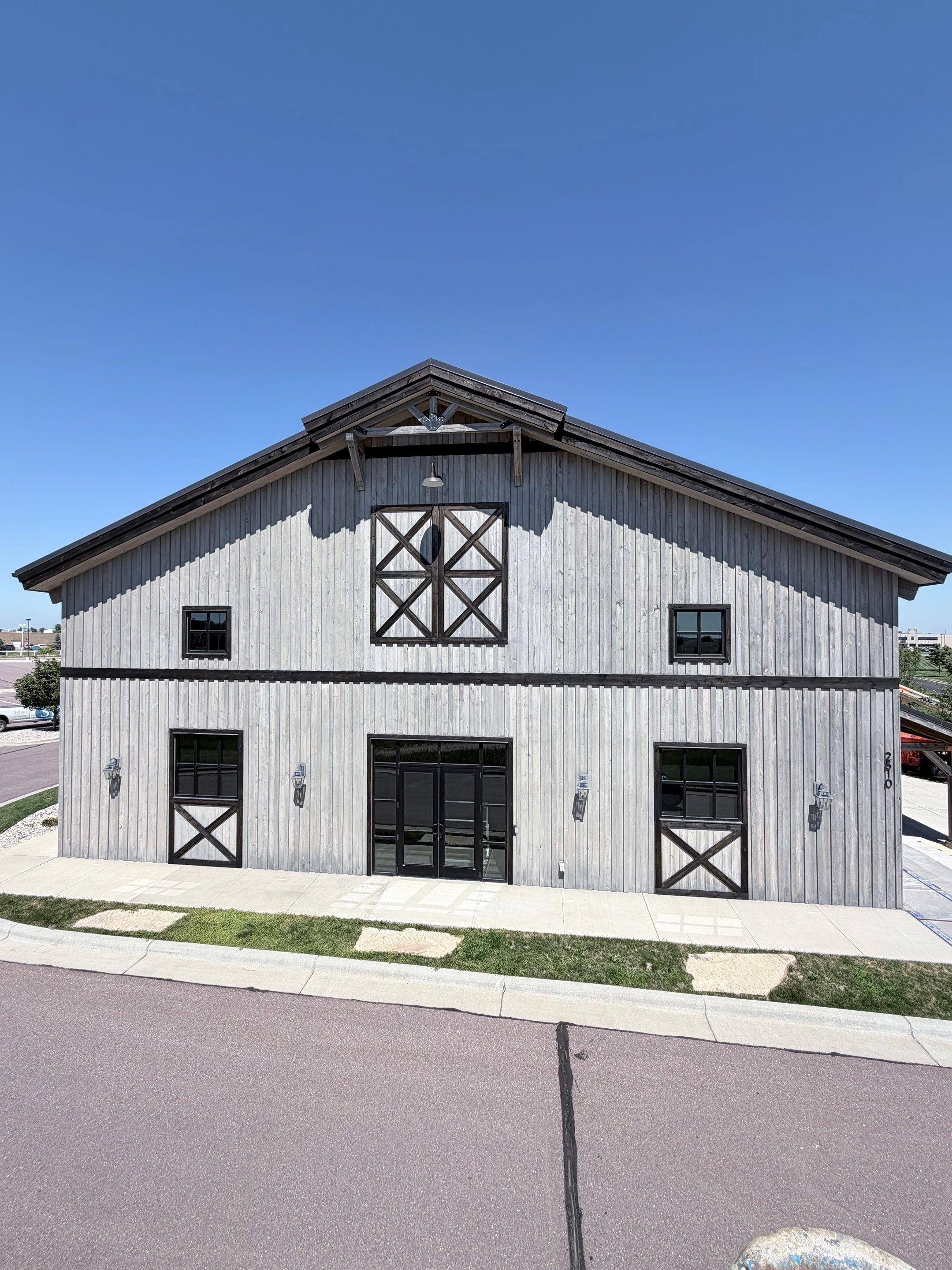 Commercial Exterior Wood Staining for Sanford Barn in Sioux Falls by Select Painting, Coatings & Garage Cabinets