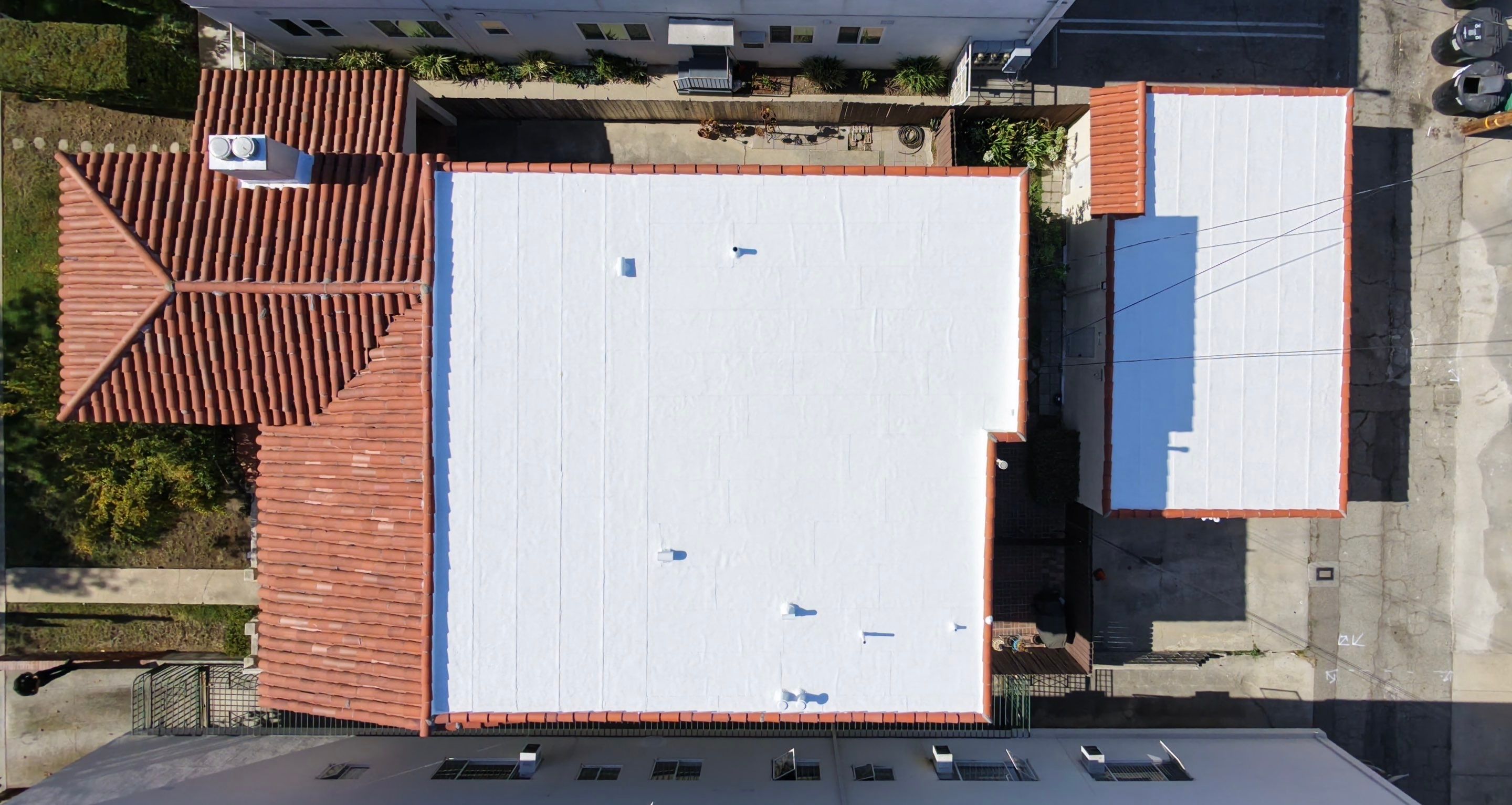 Beverly Hills Flat Roof Coating and Terracotta Tile Reset by Hull Brothers Roofing