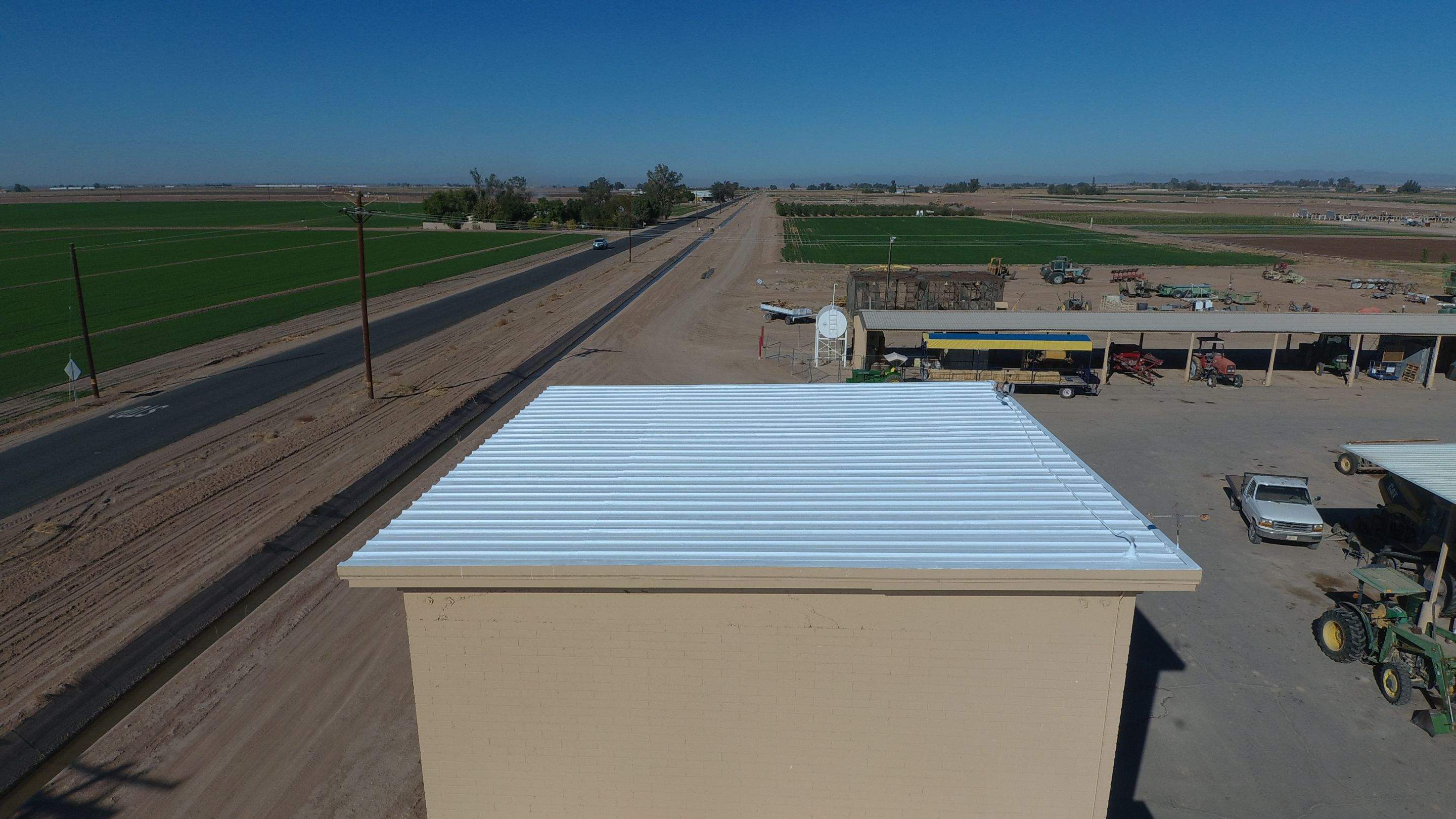 Metal roof restoration on commercial roof using Conklin Benchmark/PUMA XL fabric and coating by Straight Edge Roofing Inc