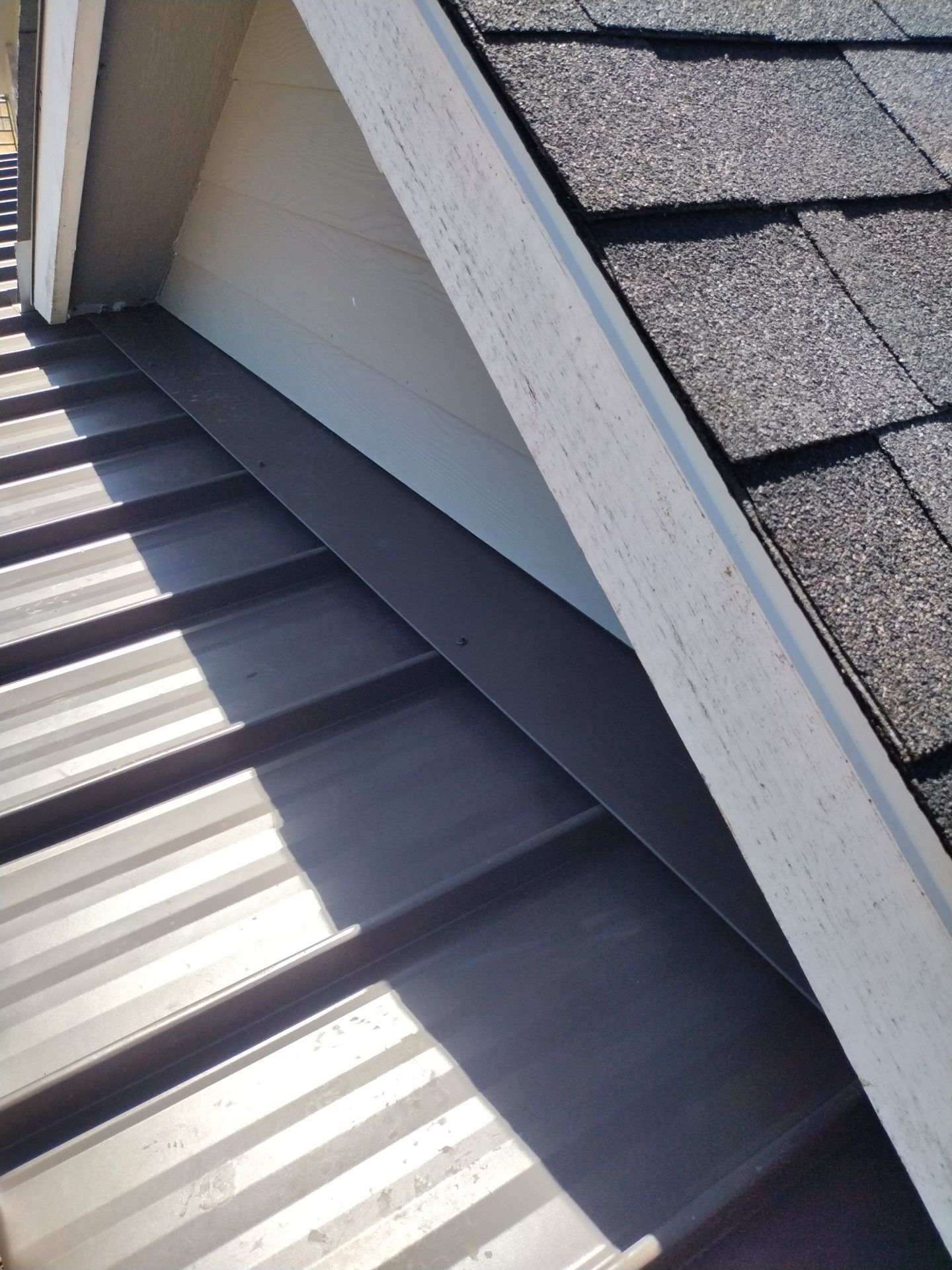 Residential Roof Replacement with Metal Accents by Orezona Building & Roofing Company, Inc.