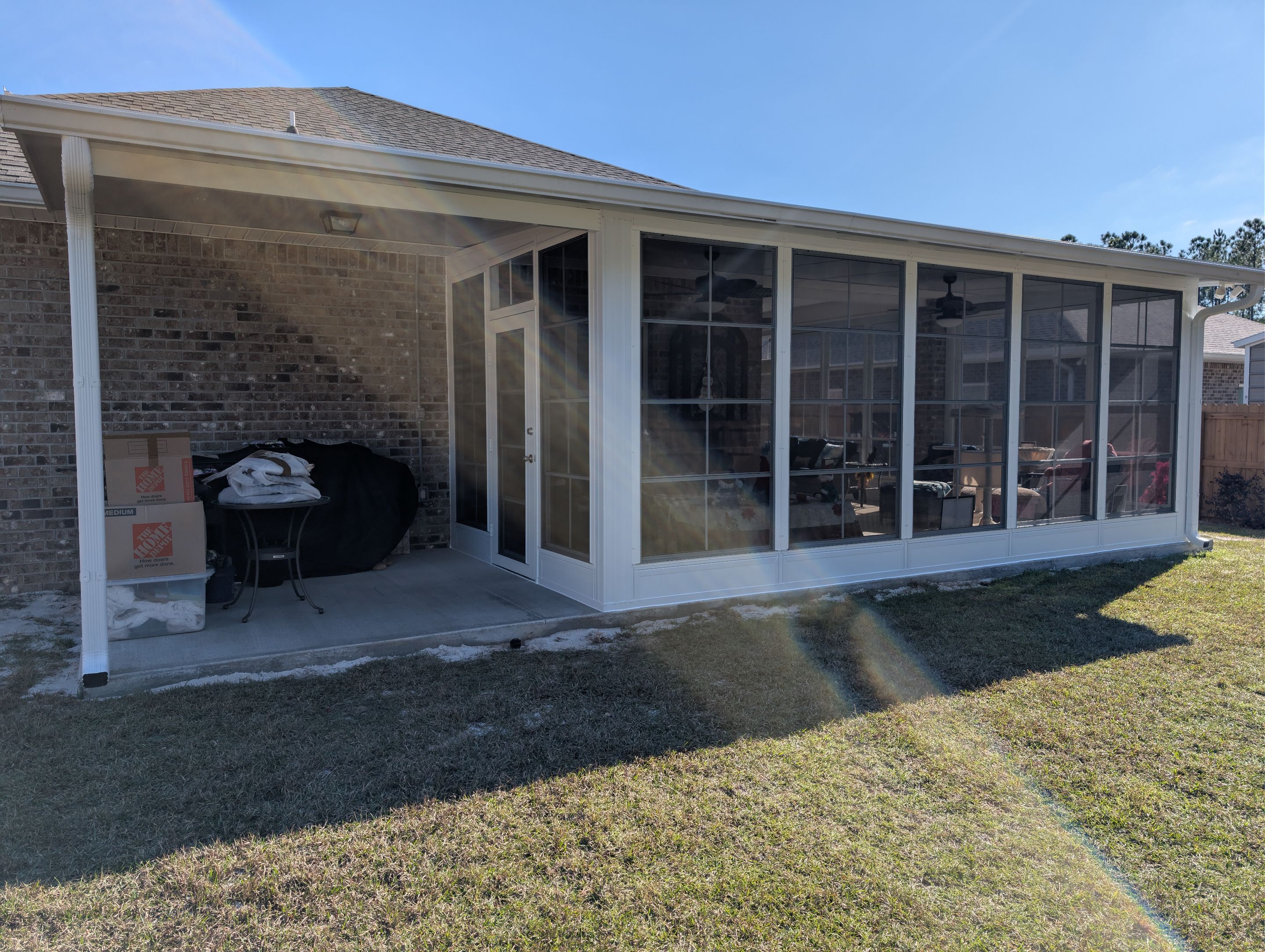 Home addition w/Vinyl 4-Track Windows by Titan Sunrooms