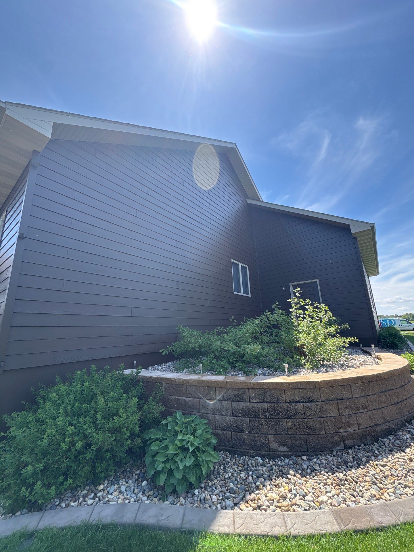 Full Exterior Renovation with Stone Veneer and Composite Decking by Select Painting, Coatings & Garage Cabinets