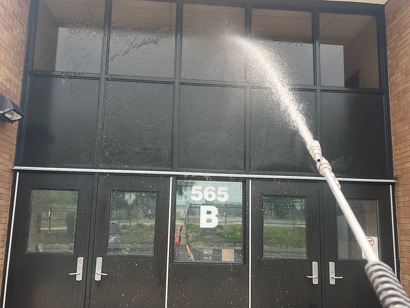Commercial brick exterior cleaning by Northern Power Washing LLC.