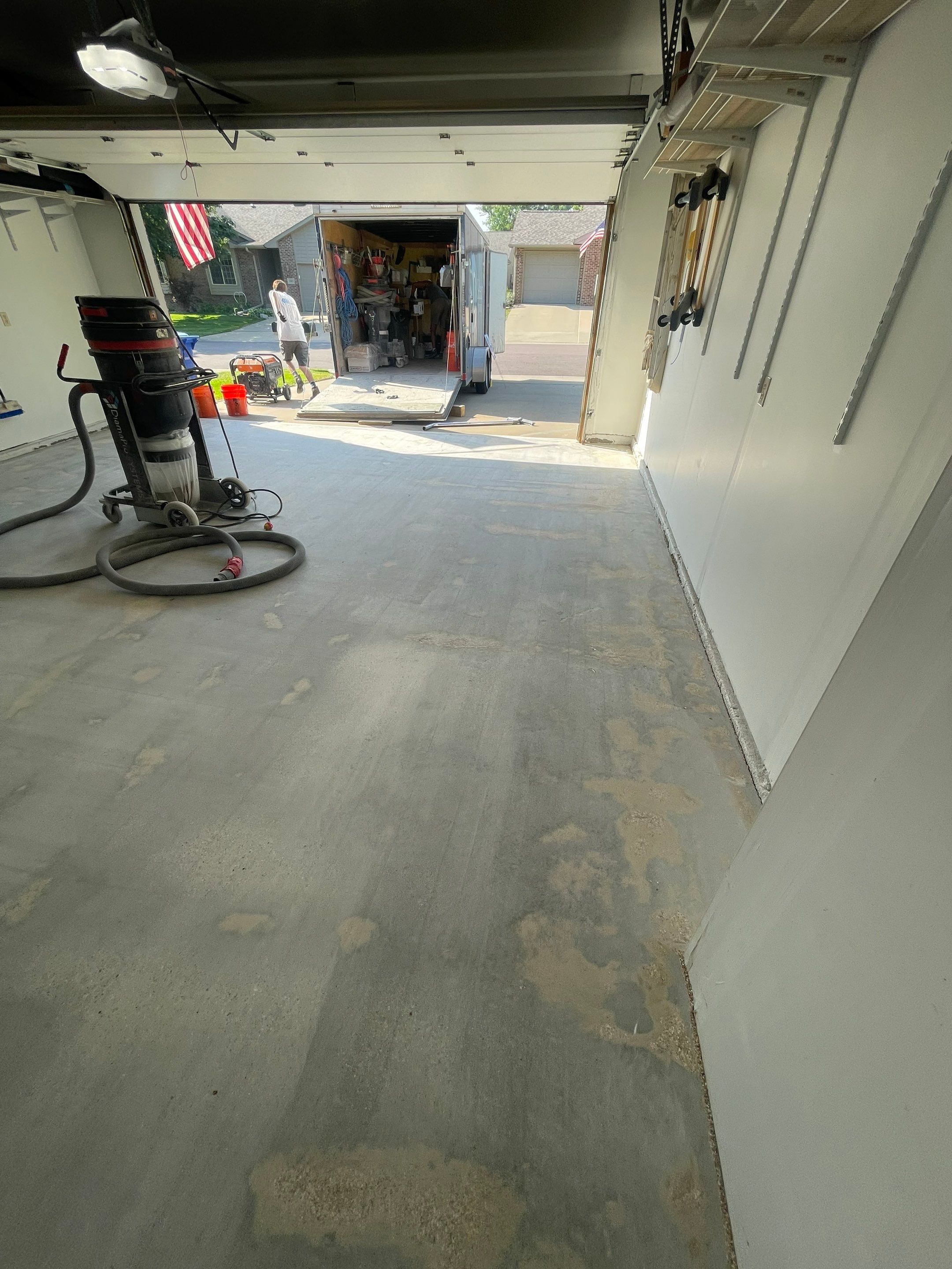 Sioux Falls Residential Garage Floor Coating with Speckled Epoxy Finish by Select Painting, Coatings & Garage Cabinets