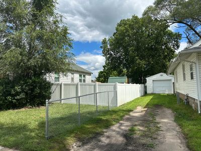 Residential White Vinyl Privacy Fence Installation in Waterloo, Iowa