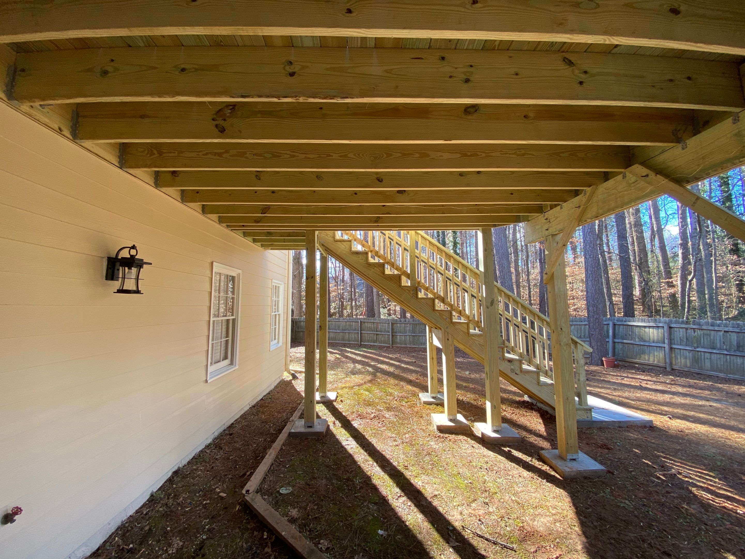 Elevated Pressure-Treated Wood Deck Replacement and Staircase in Duluth by Swift Home Renovations