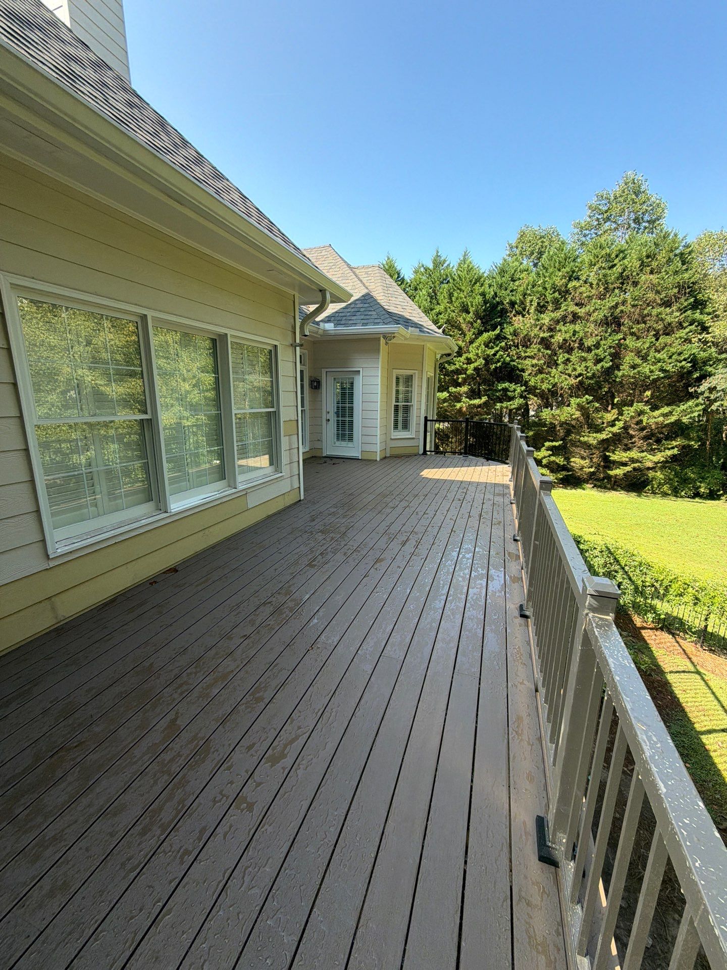 Elevated Composite Deck Replacement with Metal Railings in Smyrna by Swift Home Renovations 