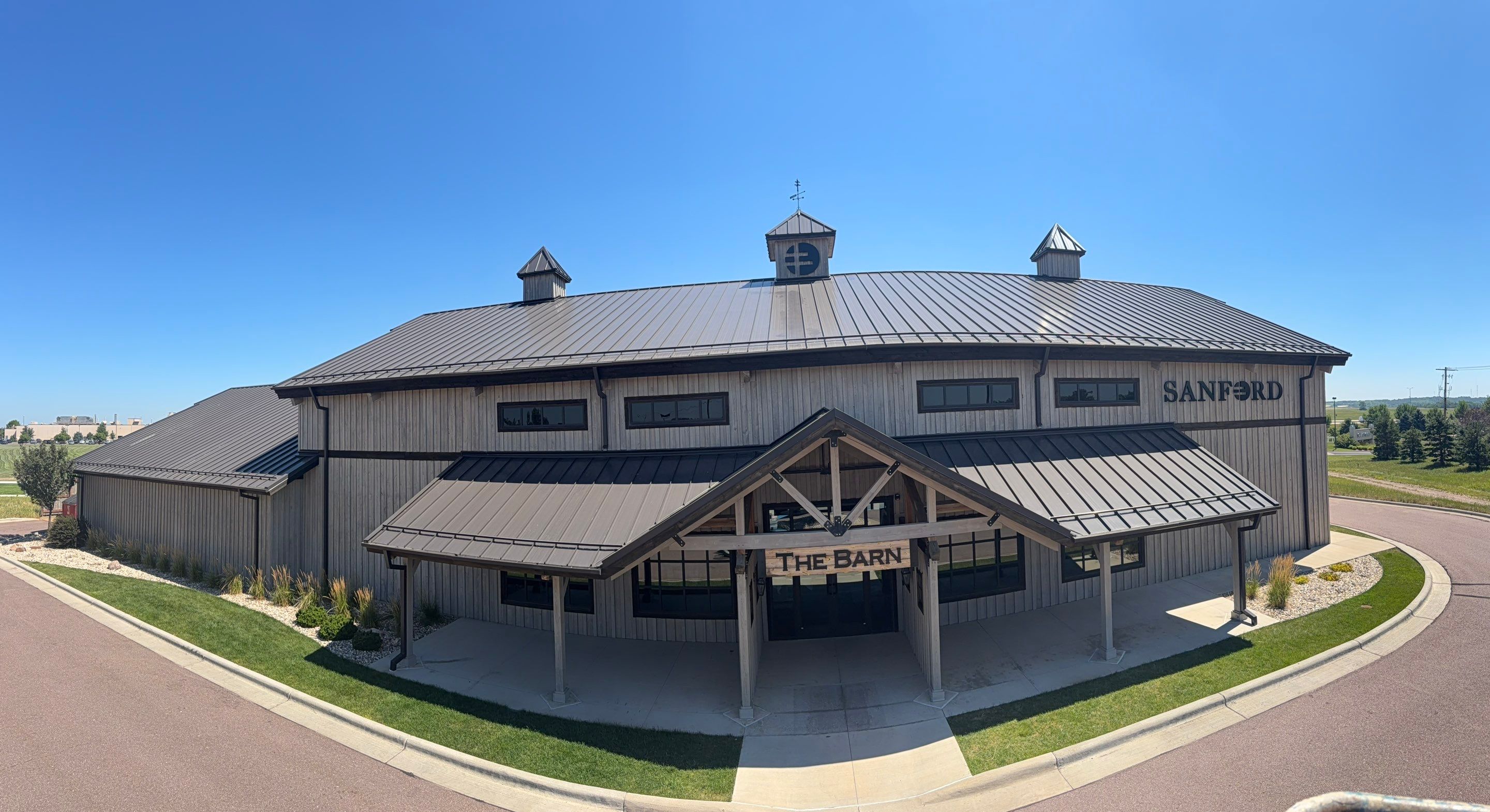 Commercial Exterior Wood Staining for Sanford Barn in Sioux Falls by Select Painting, Coatings & Garage Cabinets