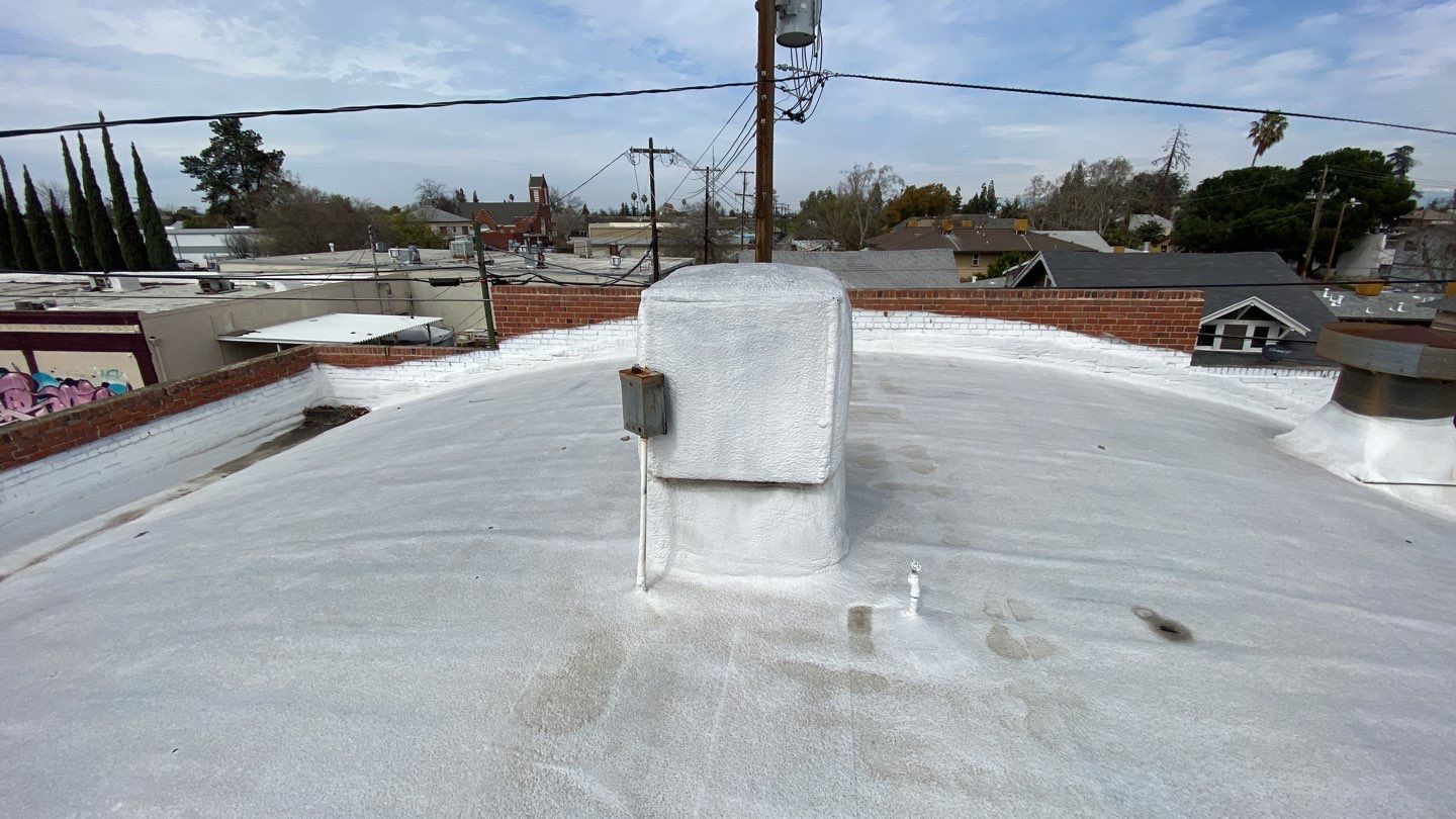 Polyurethane foam roof refurbish and recoating by Straight Edge Roofing Inc
