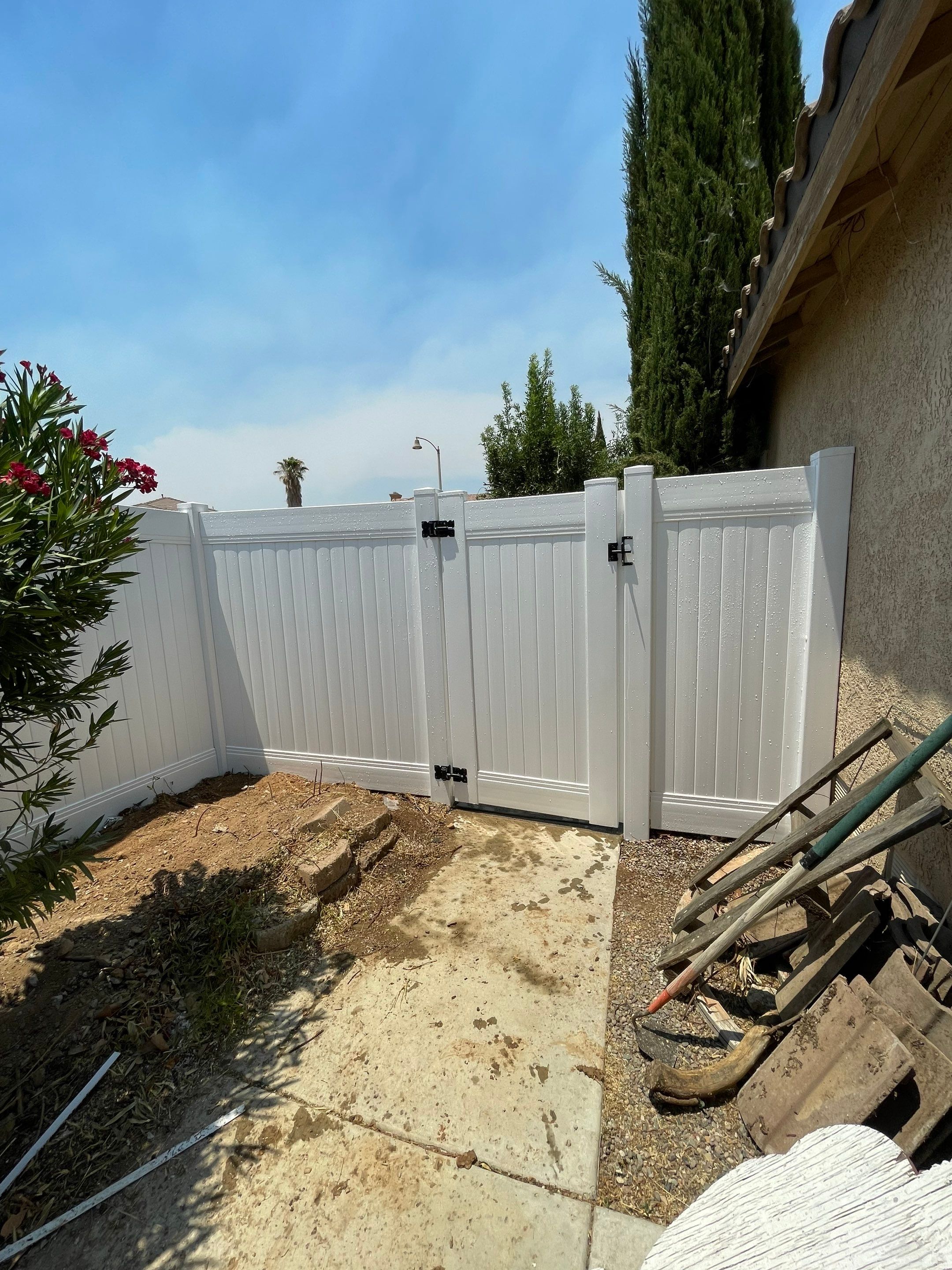 Gate installation using Vinyl by Fence Guys Inc. 