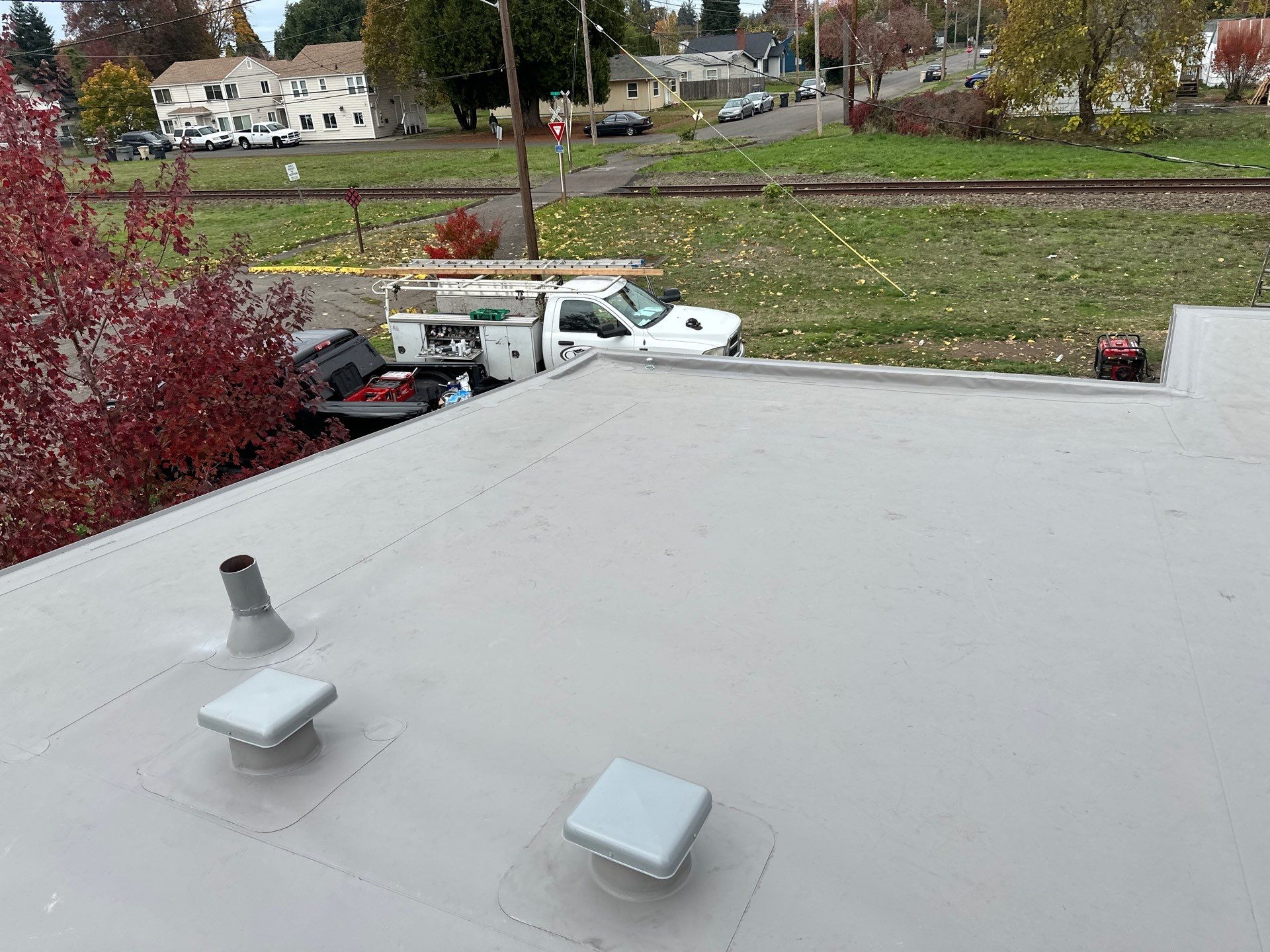 Residential Membrane Roof Replacement by Orezona Building & Roofing Company, Inc.