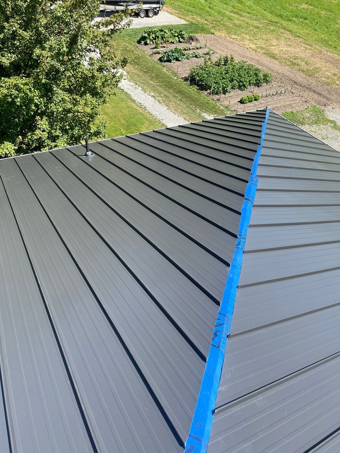 Residential Roofing Installation using 12" Prolok metal  by Top Notch Roofing Inc