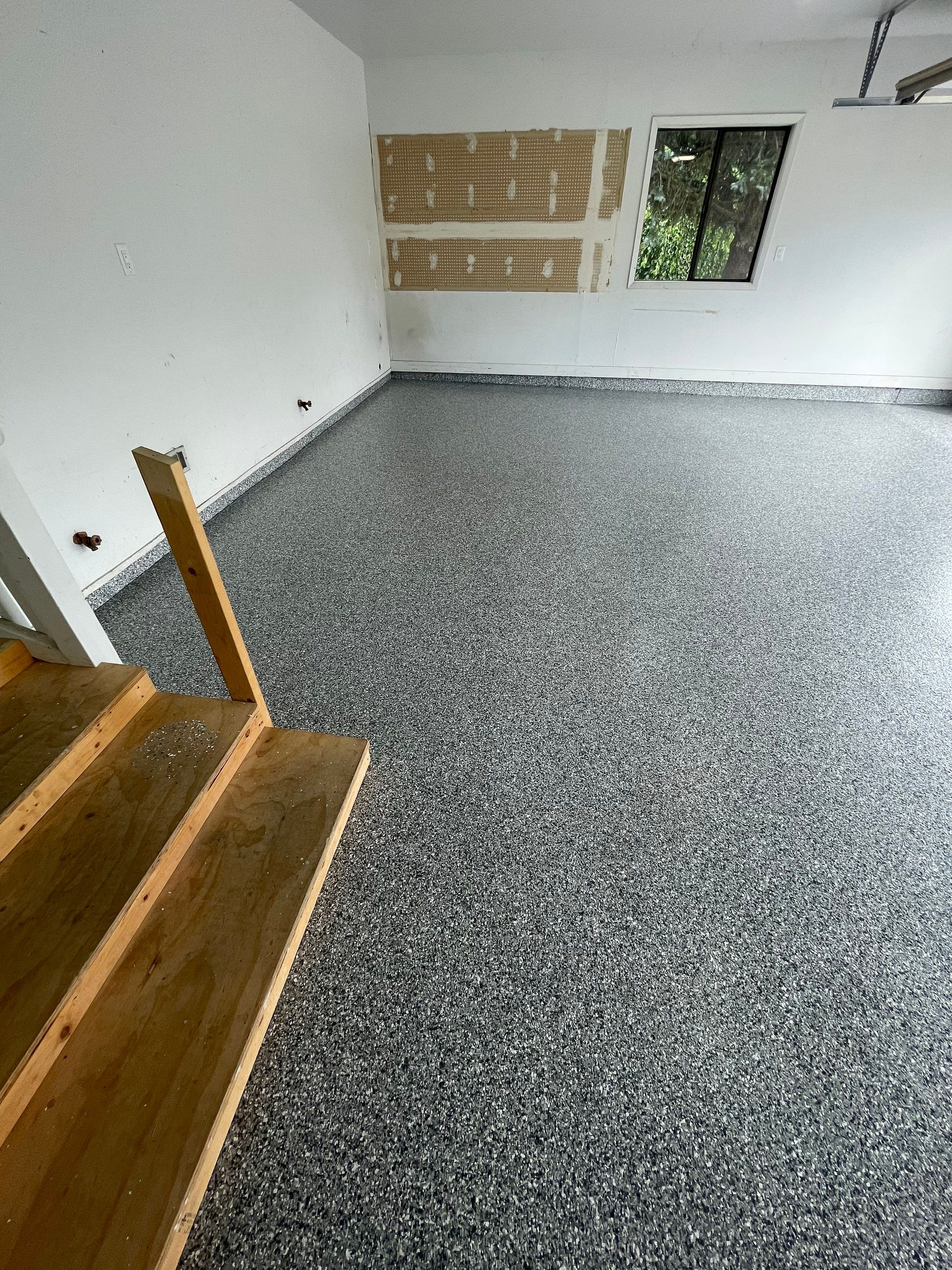 Grey Speckled Concrete Coating for Residential Garage in Yankton by Select Painting, Coatings & Garage Cabinets