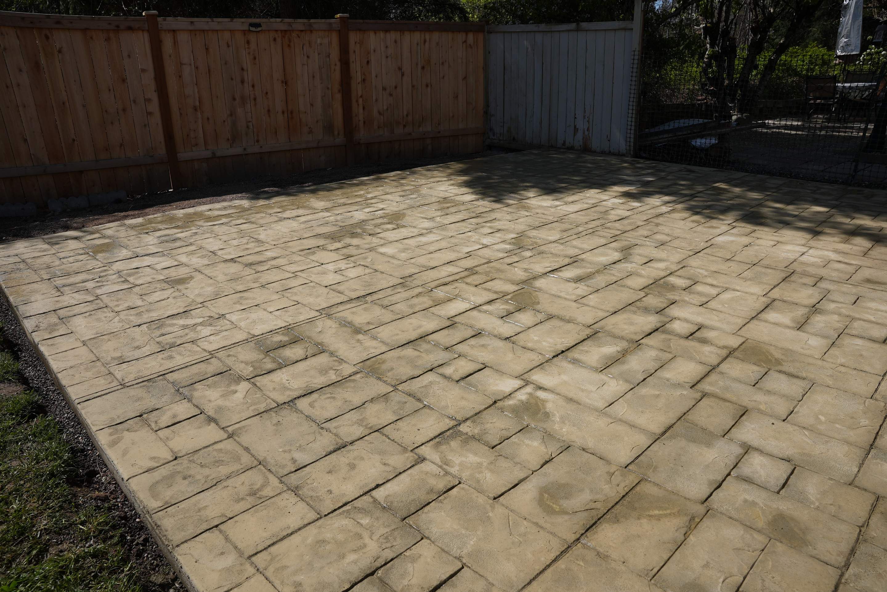 Benedict | Stamped Concrete Back Patio by Jireh Asphalt & Concrete Inc 