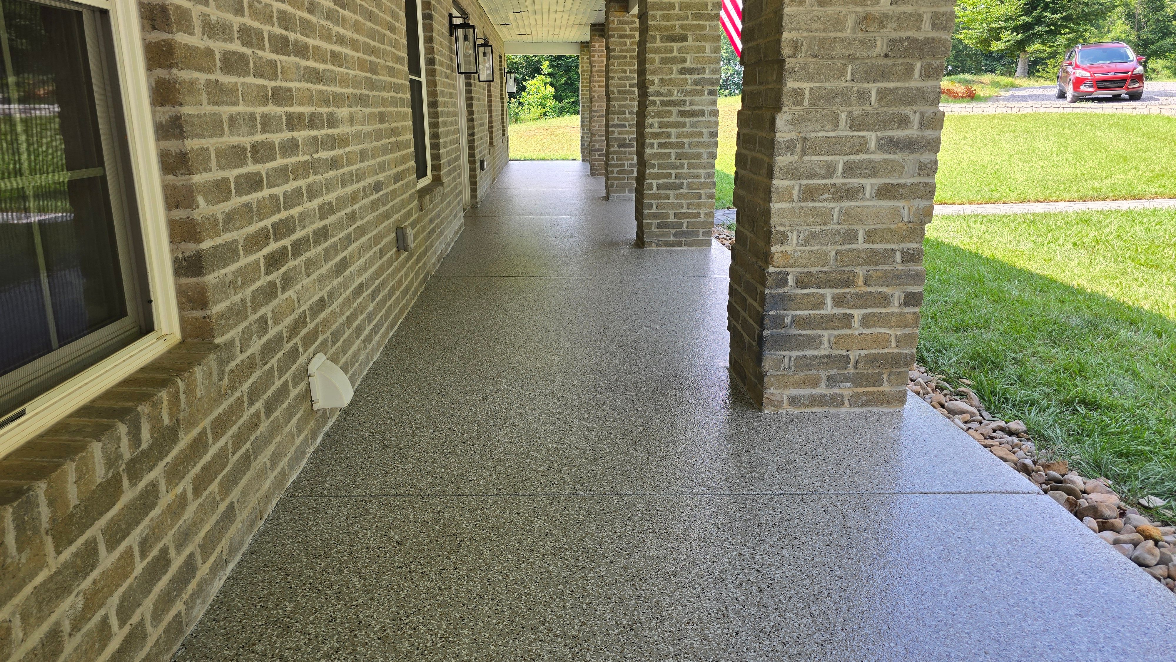 Back Patio using Creekbed by Elite Floor Solutions