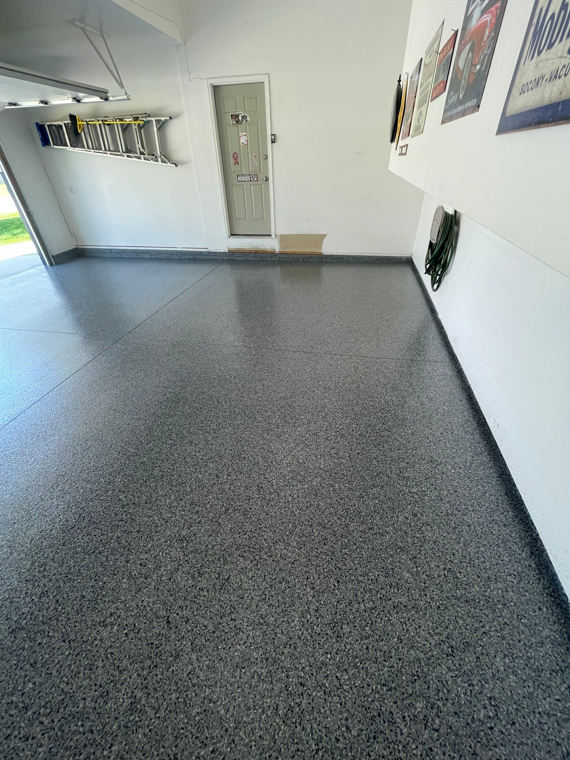 Sioux Falls Garage Floor Coating with Nightfall Decorative Chips by Select Painting, Coatings & Garage Cabinets
