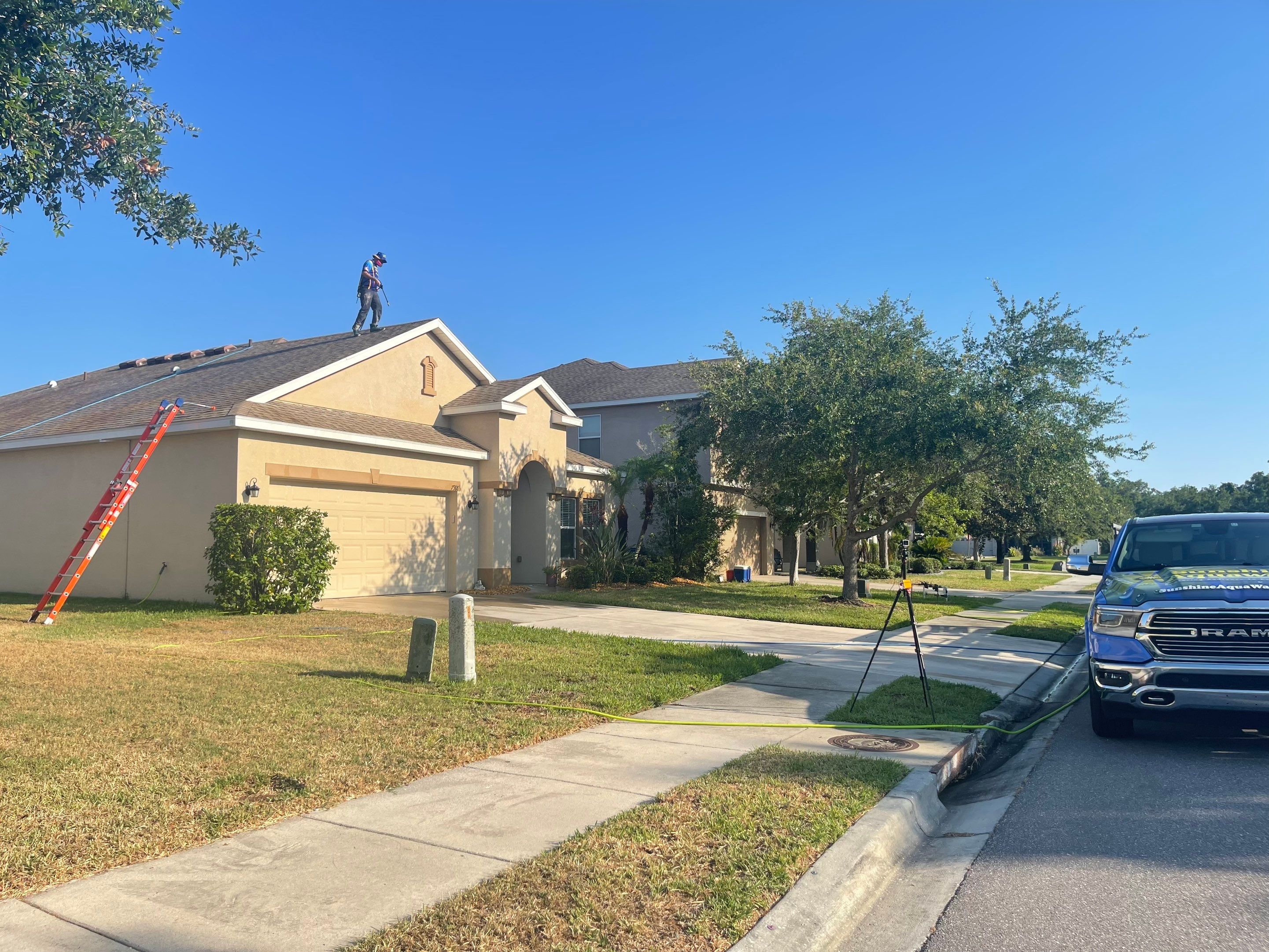 Asphalt Shingle Roof Soft Wash Cleaning & Concrete Pressure Washing in CopperStone Community, Parrish, FL by Sunshine AquaWash