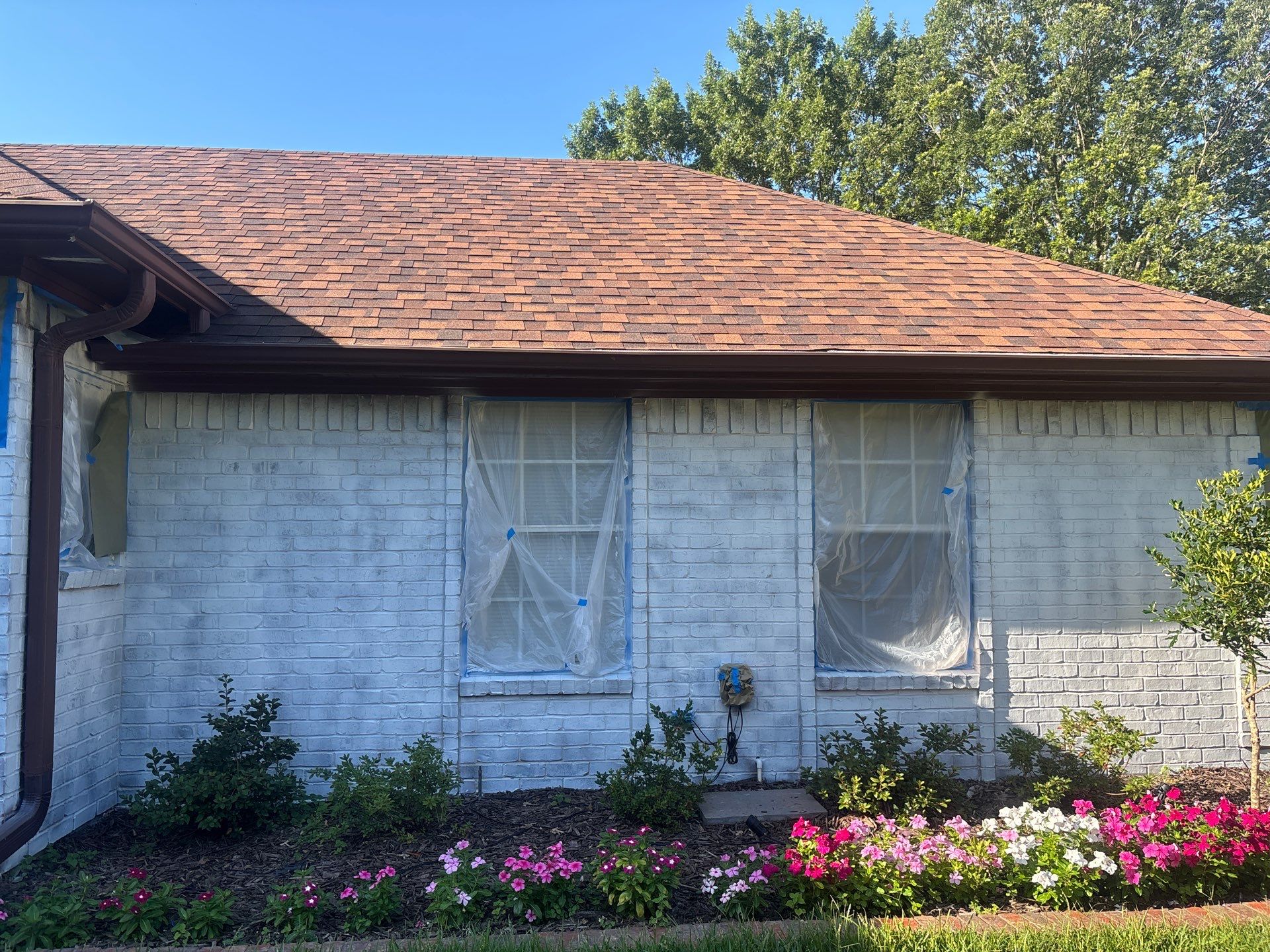 Project in TylerExterior Painting in Tyler, TX | White Brick Home, Varnished Fence & Shed Painting by Quality Coats Painting