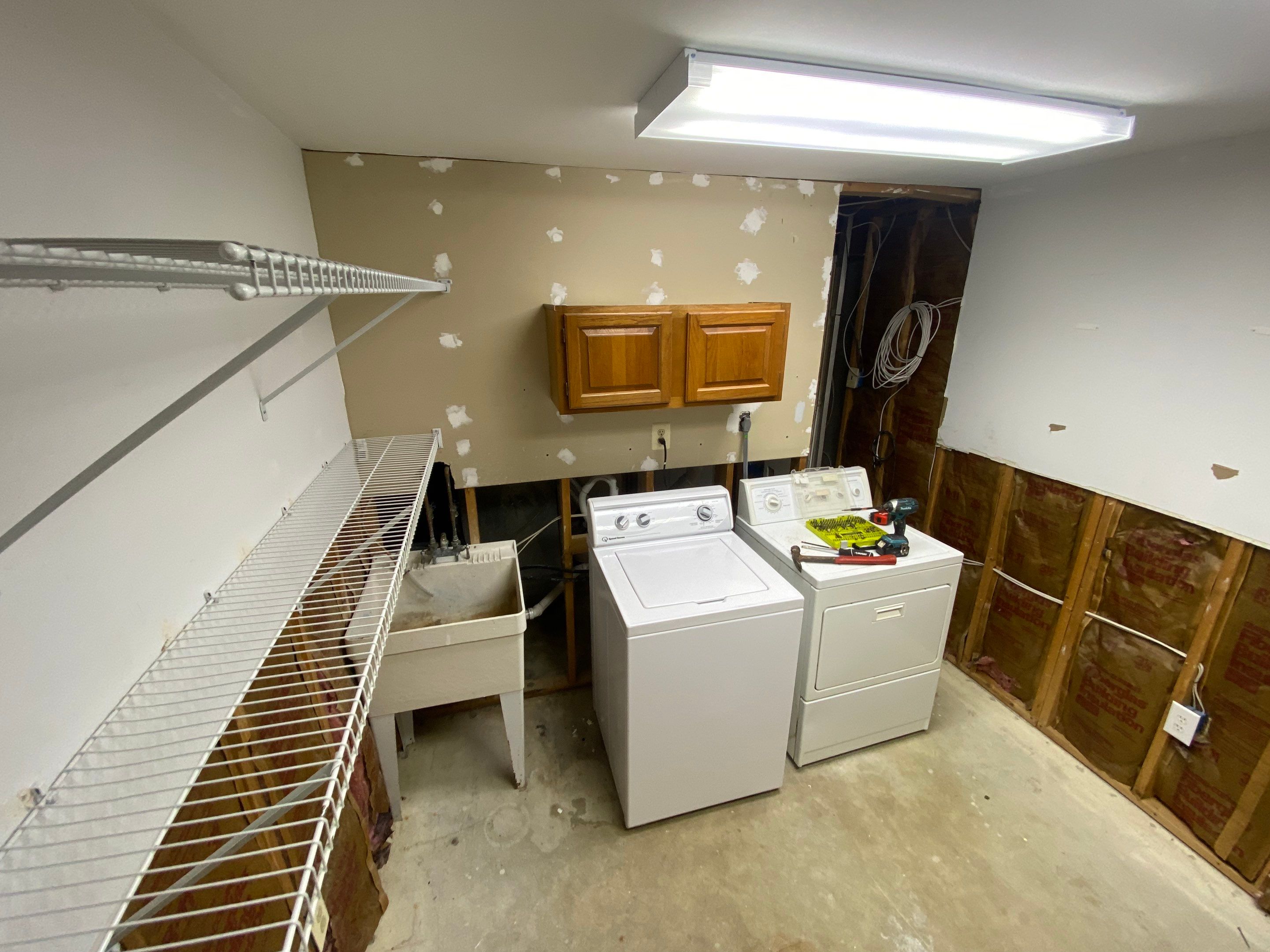 Laundry Room Redmodel using Lifeproof Luxury Vinyl Plank Flooring by The Smet Companies, LLC