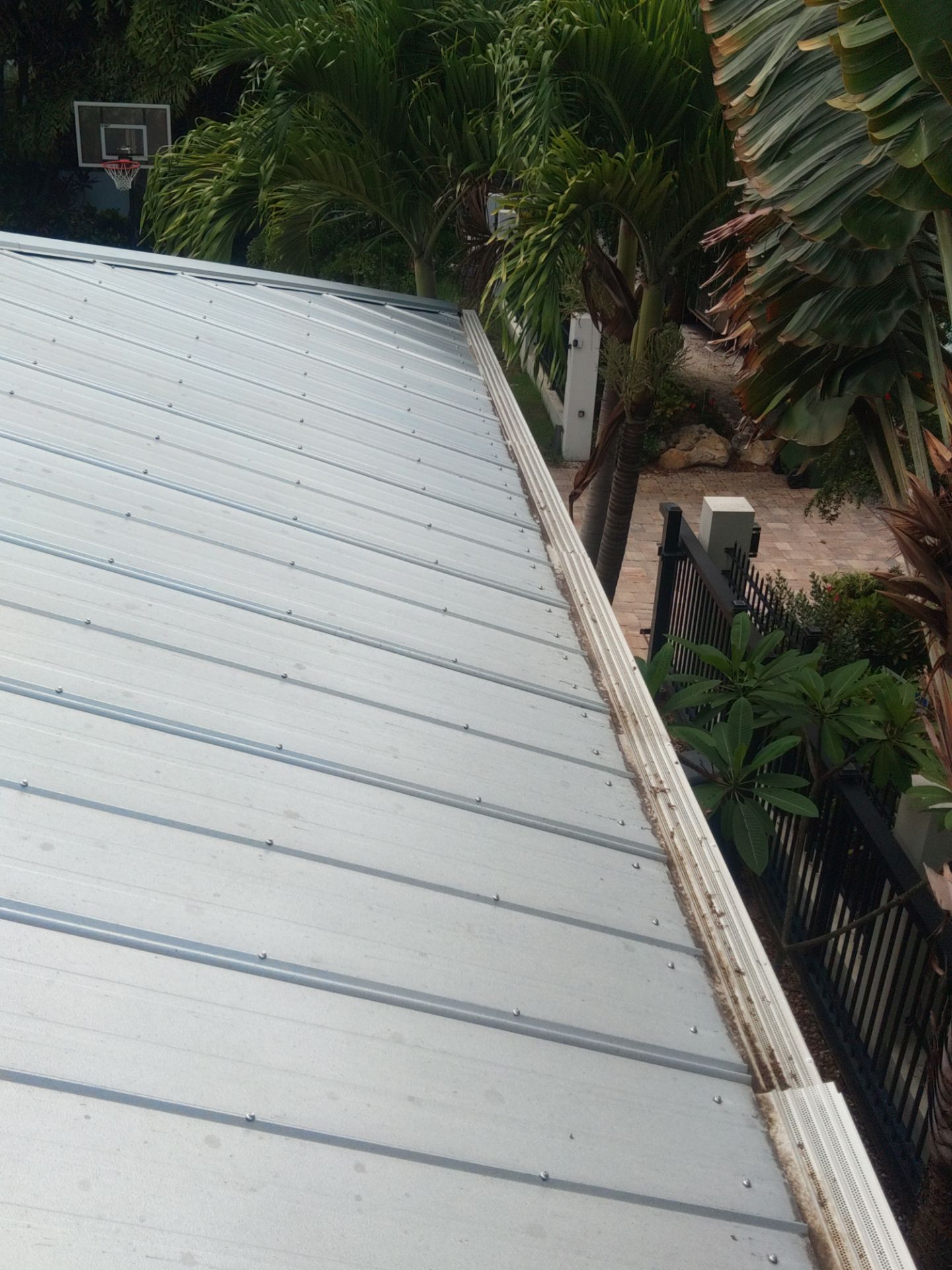Gutter guards installation combined with gutter cleaning in Sarasota, FL by Gutter Professors