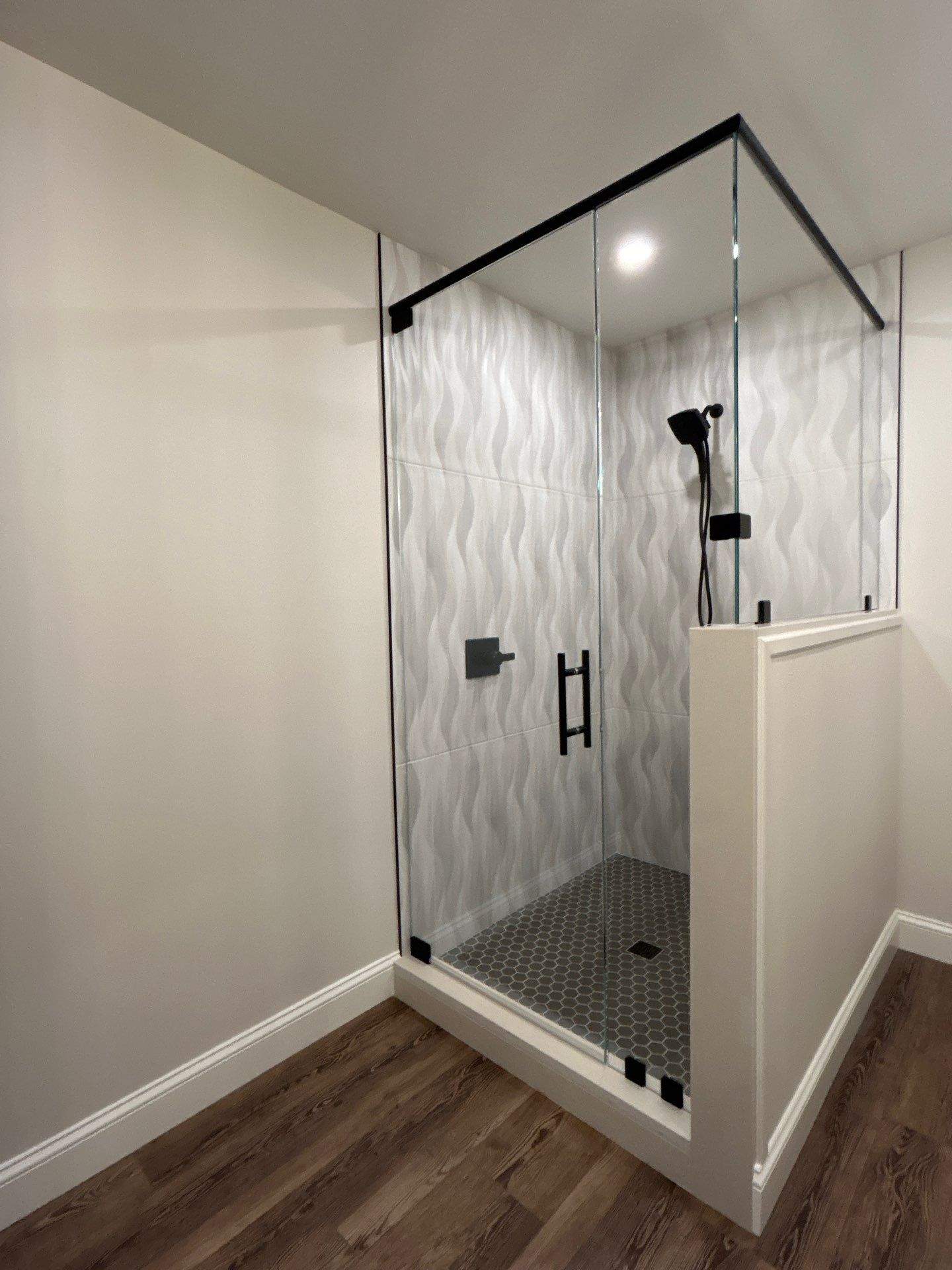 Frameless Shower Enclosure w/Header Bar by Cheshire Glass Company