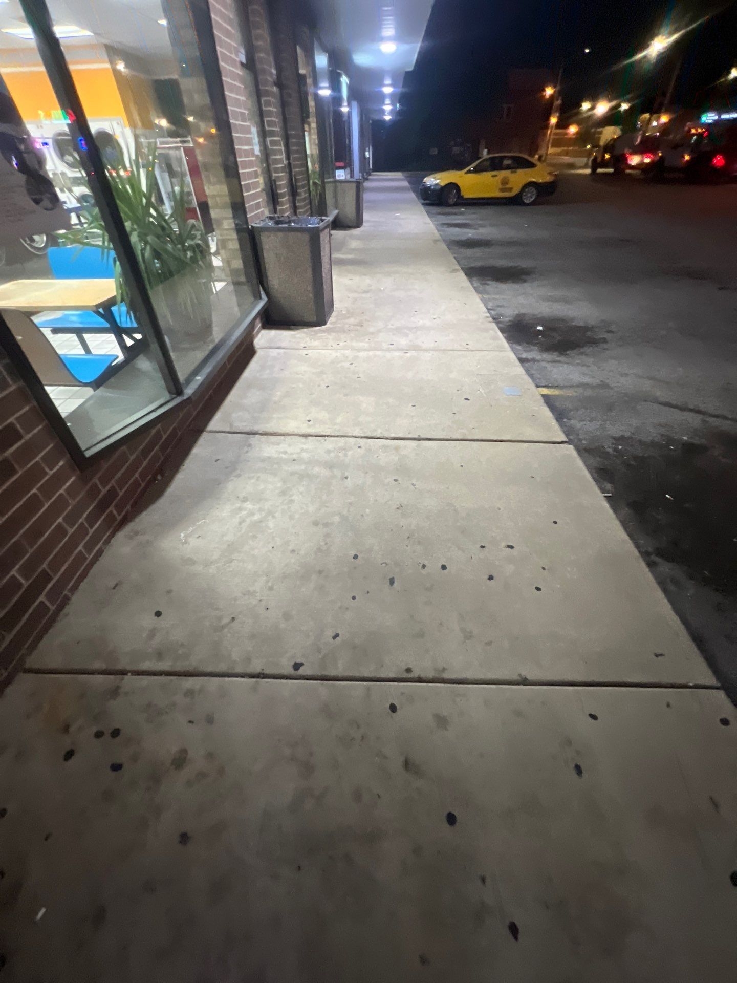 Commercial sidewalk cleaning. by Northern Power Washing LLC.