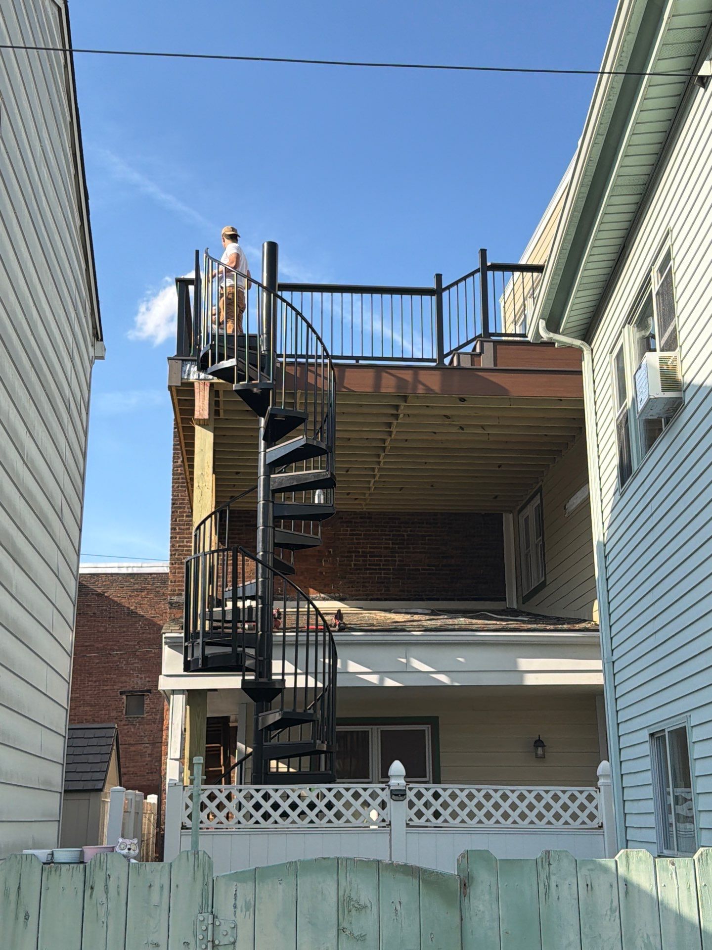 Larry Dietrich Spiral stair and deck by Cousins Roofing Siding & Decks