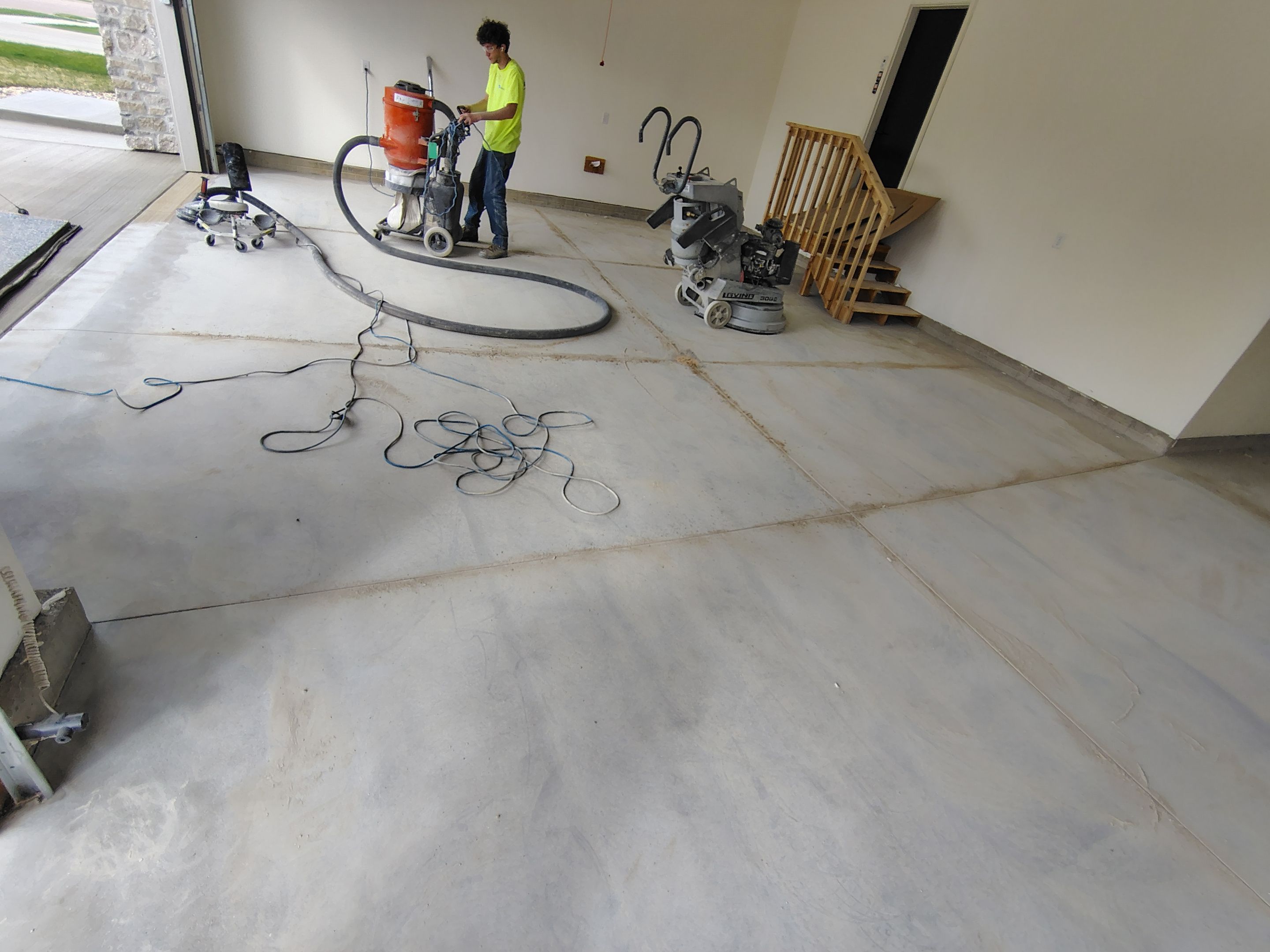 Sioux Falls Garage Floor Transformation with Gray Decorative Flake Coating by Select Painting, Coatings & Garage Cabinets