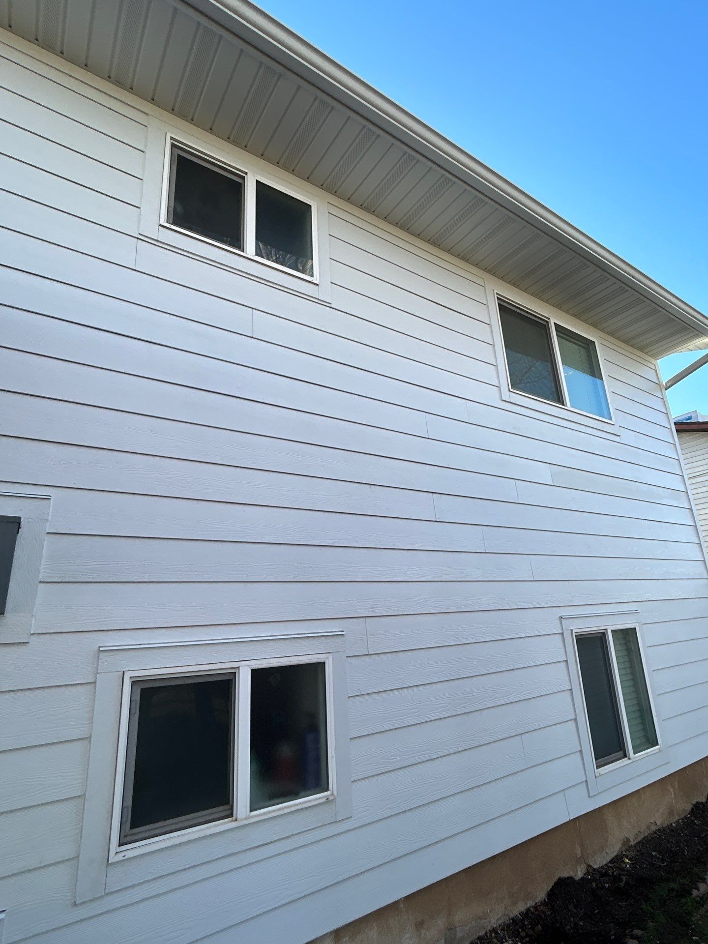 Orem | Crisp Monochromatic Hardie Upgrade | Arctic White by Ideal Siding Utah