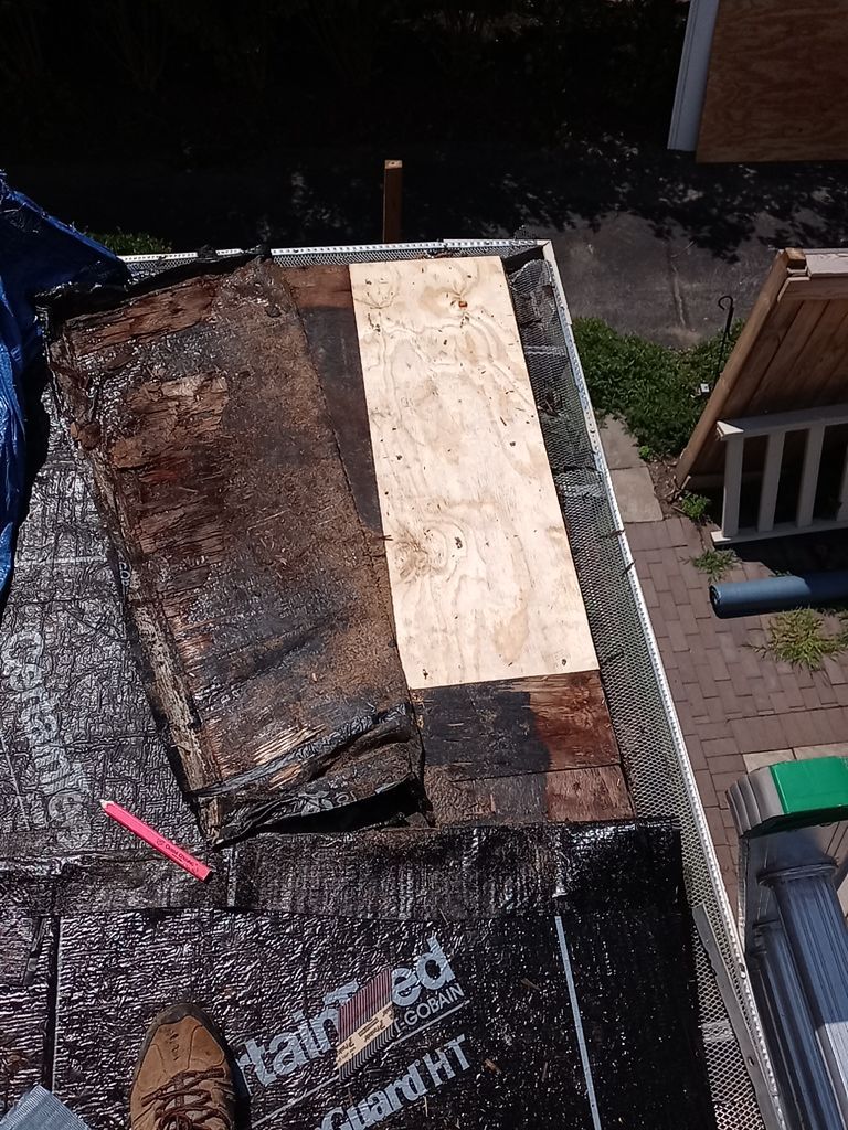 Residential Roofing Installation, Dec-tek walk-out porch roof, siding on garage by Absolute Roofing and Construction