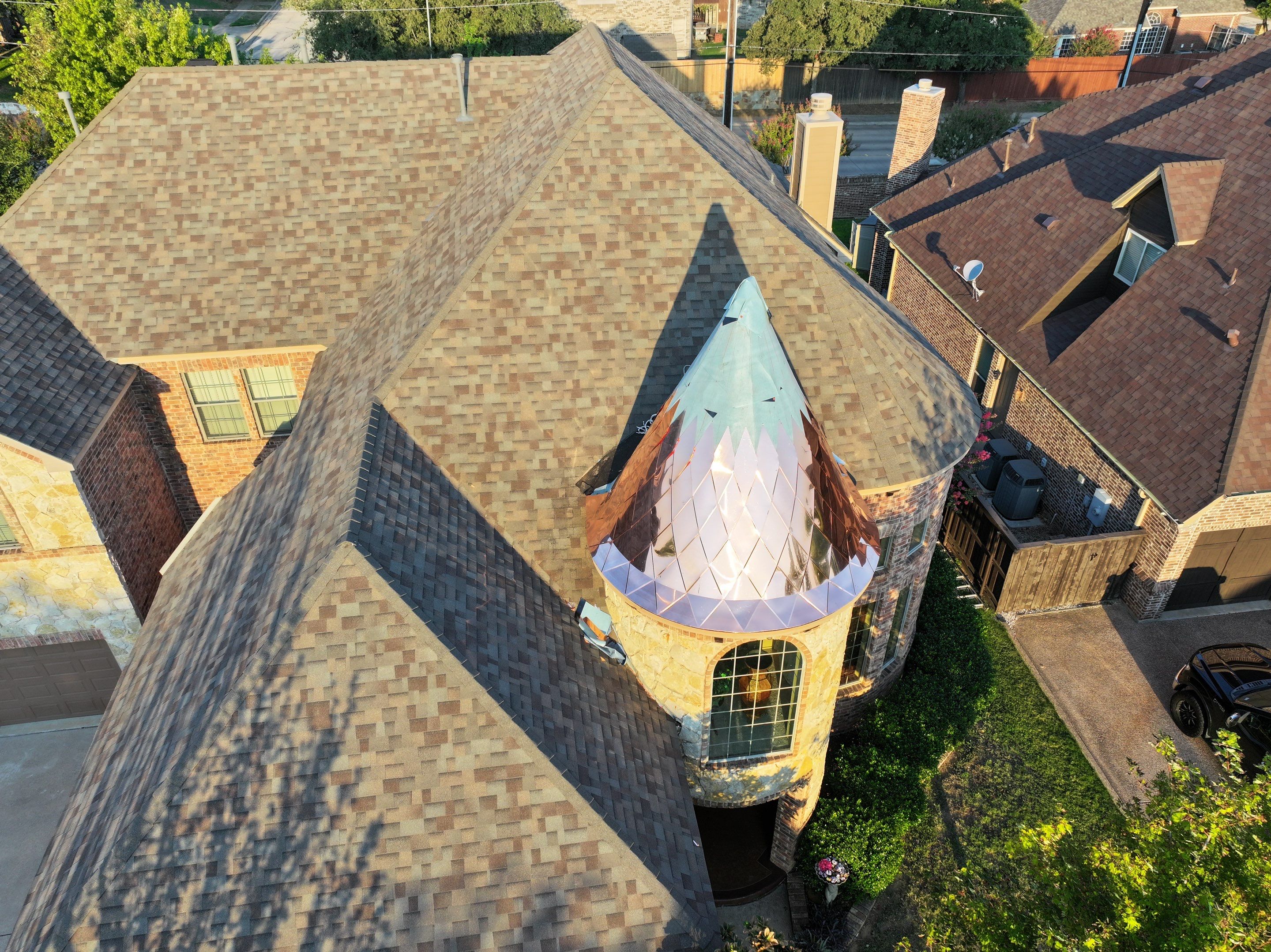 Installing Custom copper turret and Malarkey Vista Class 4 shingles Hail Damage Upgrade by Becker Roofing and Exteriors