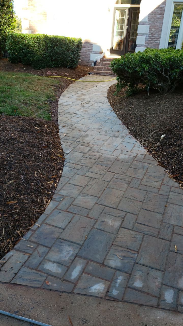 Driveway Clean using cleaner by Power Wash Masters LLC