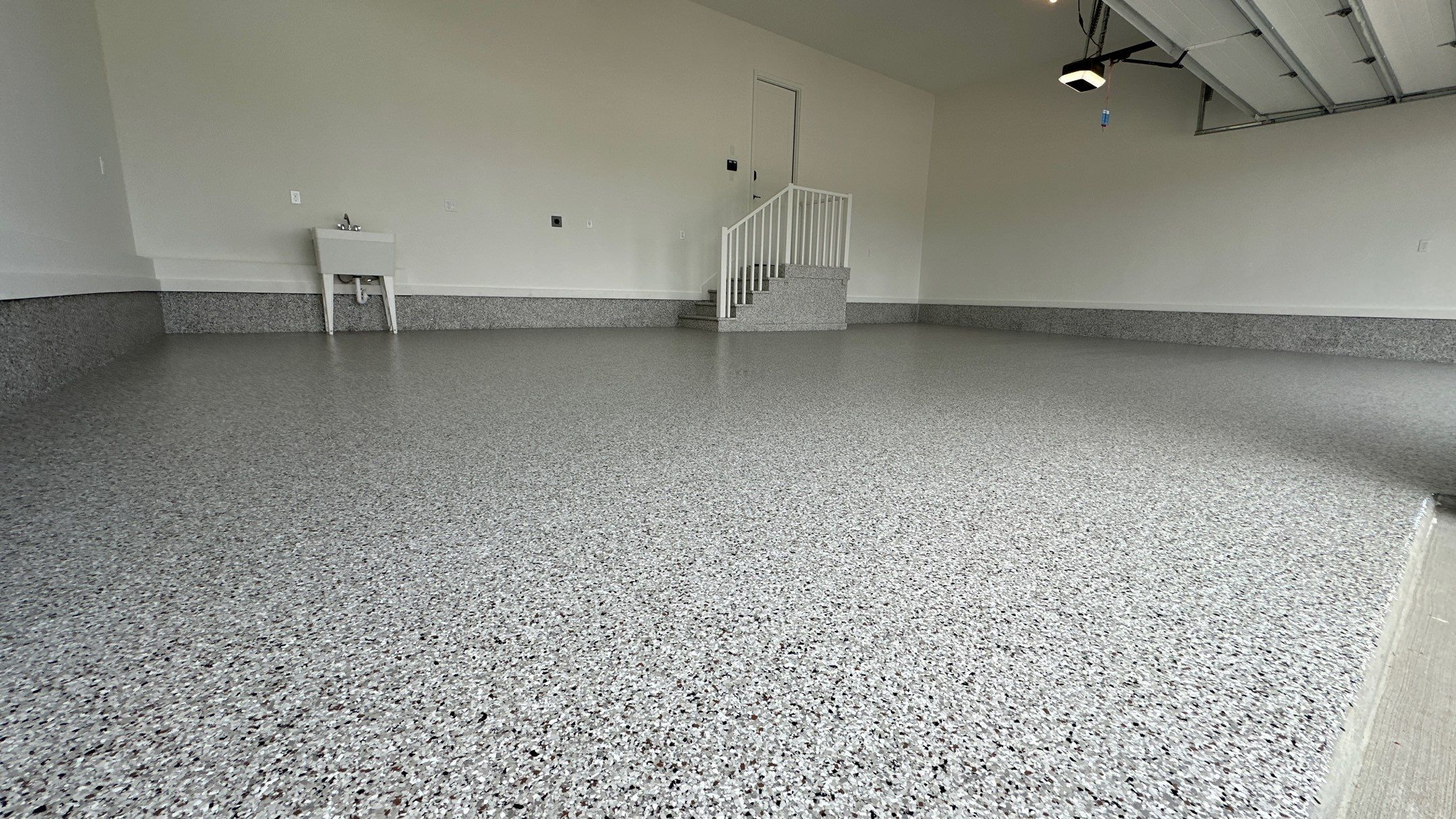 Ben B. completed his home with a new garage floor  by Banner Garage
