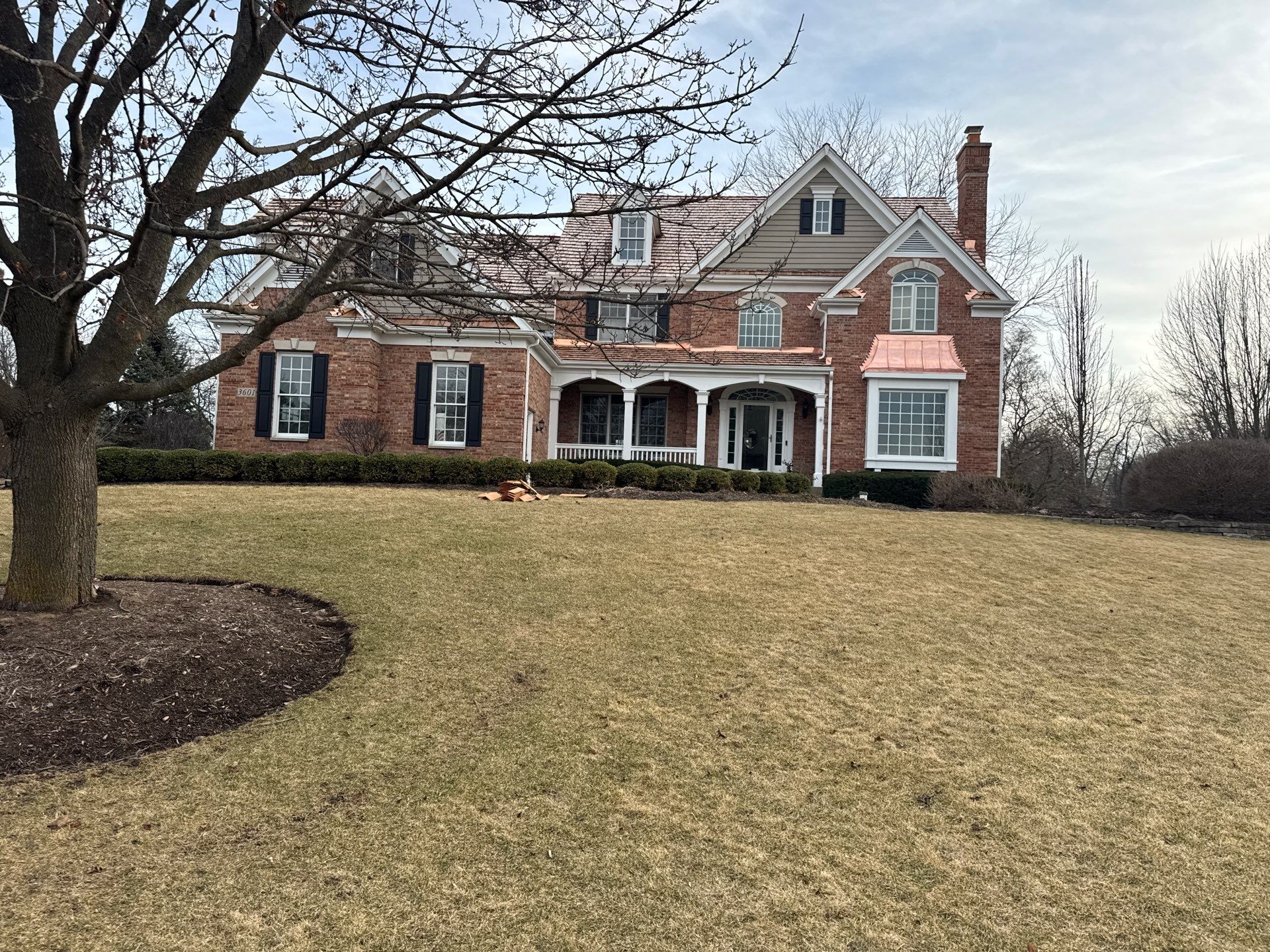 Re-roof: Cedar Shake & Custom Copper by Midwest Building Solutions